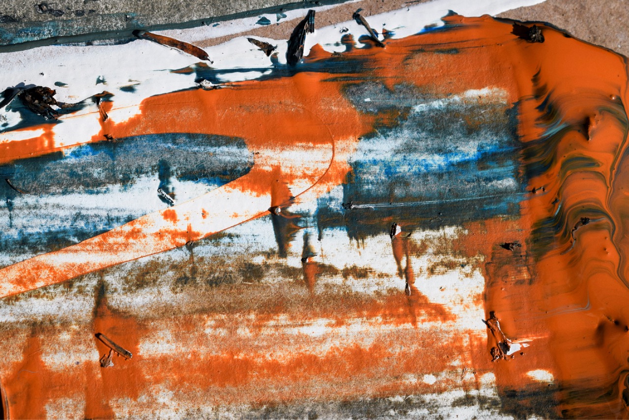 An abstract painting in orange and blue