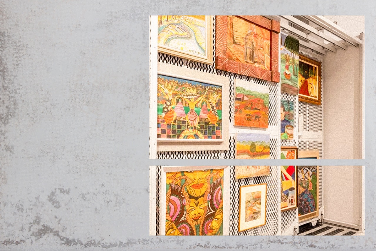 Framed works catalogued on gallery storage racks
