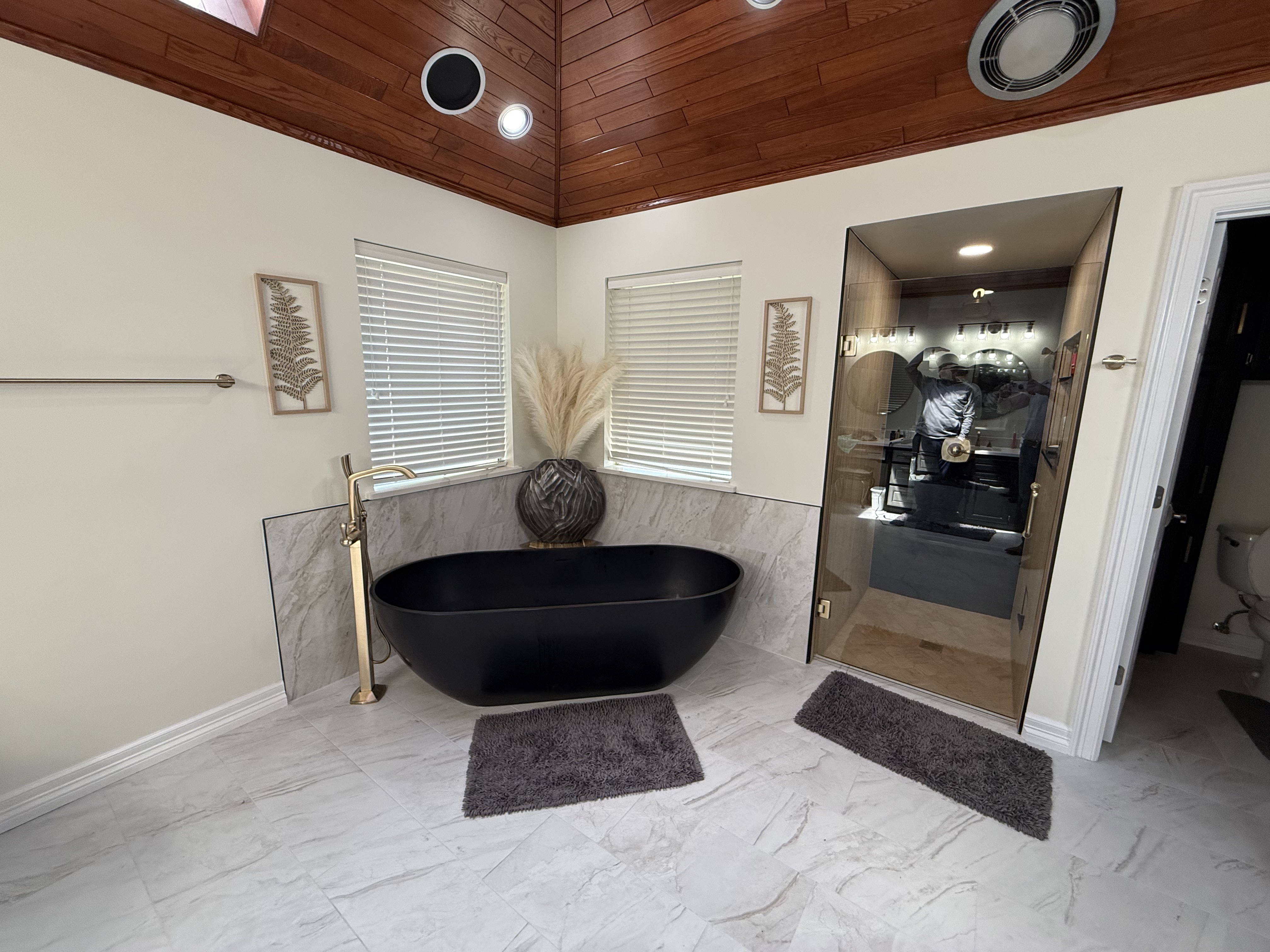 Completed Euless master bathroom remodel with enlarged walk-in shower and freestanding tub by Redcrest Construction