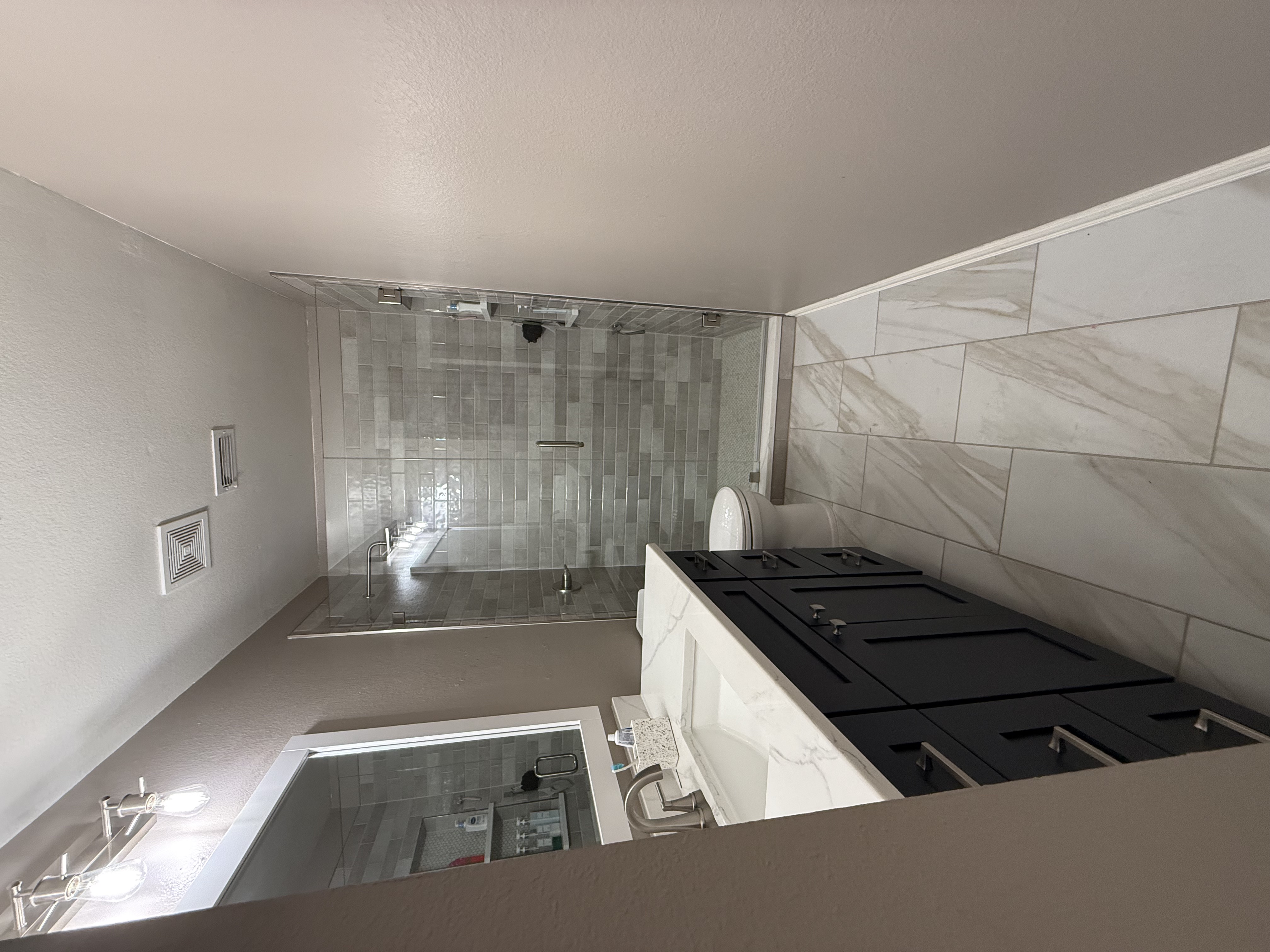Finished walk-in shower remodeling project in Lewisville, Texas by Redcrest Construction
