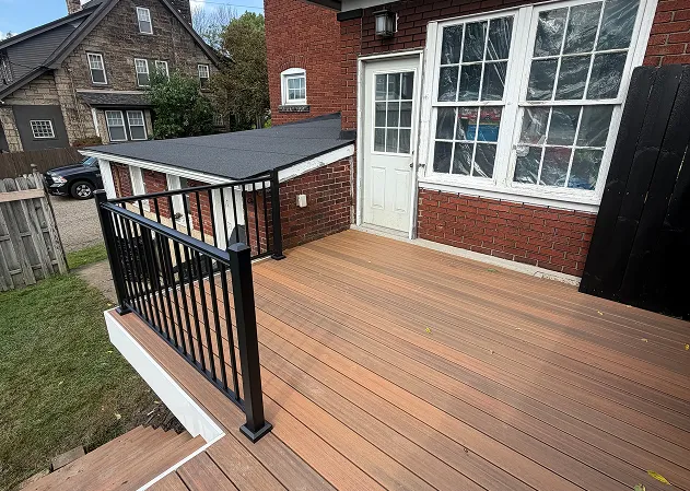 Residential deck with composite decking and black railing