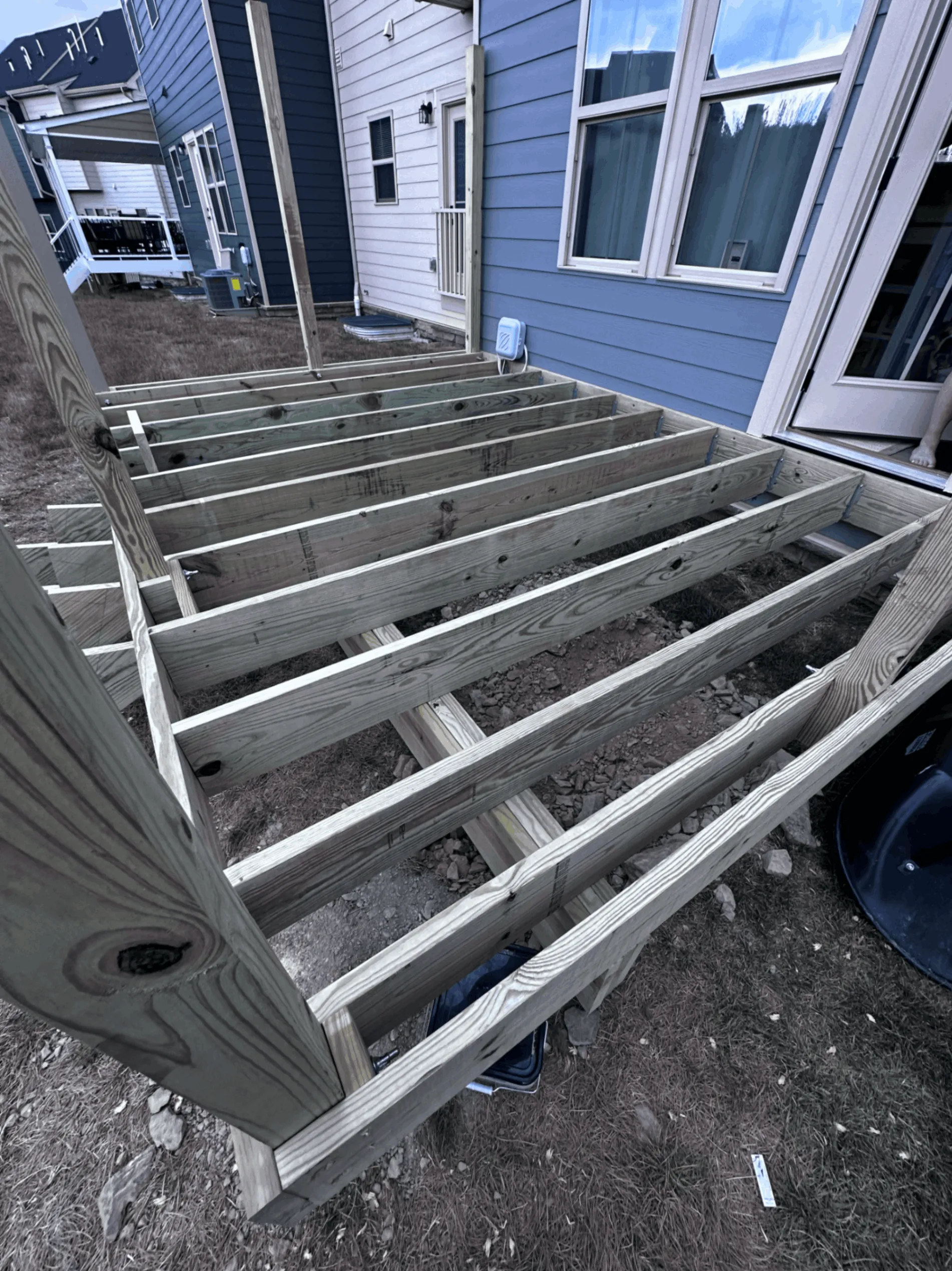 Close view of deck joists and support beams during framing