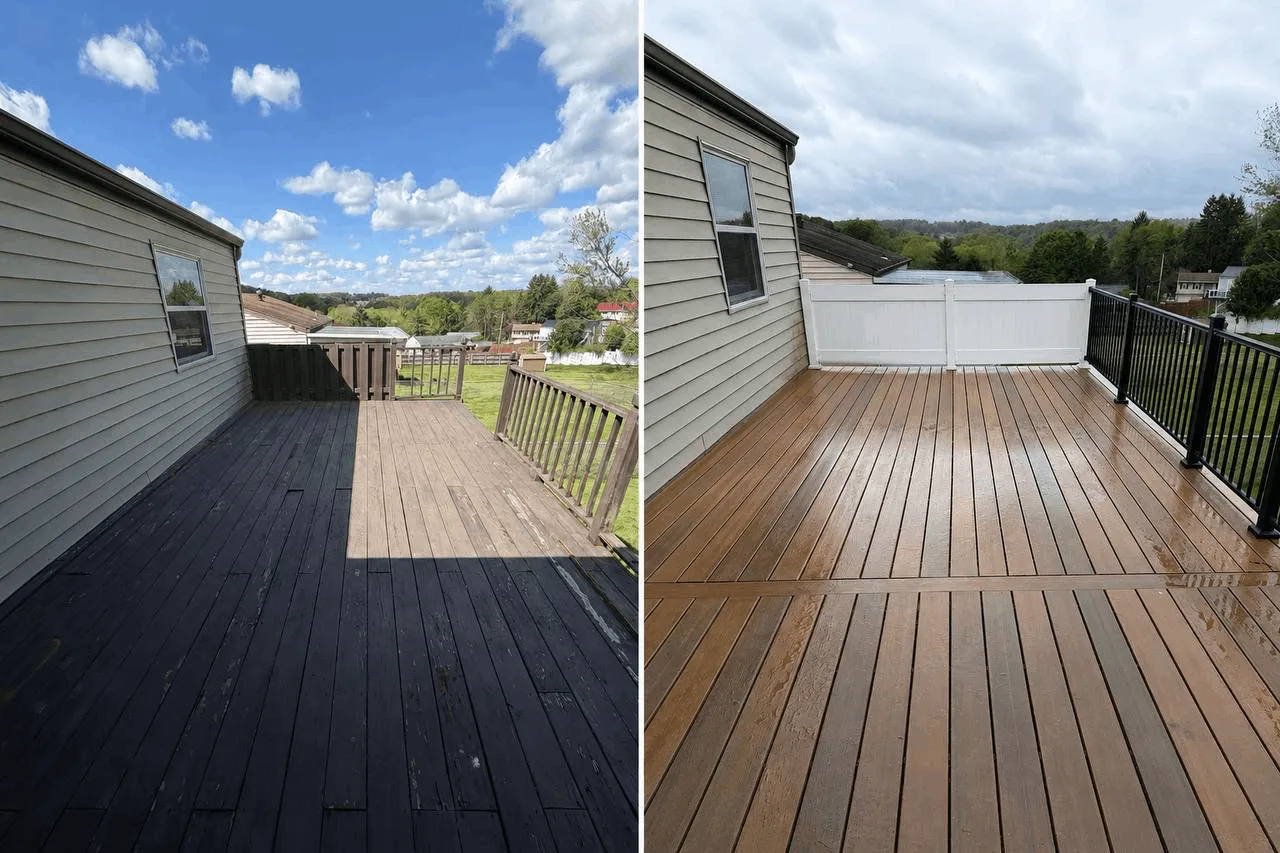 New deck built from the ground up with gray decking and white railings.