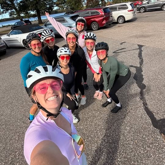 Sydney taking a selfie with the gang lined up behind her