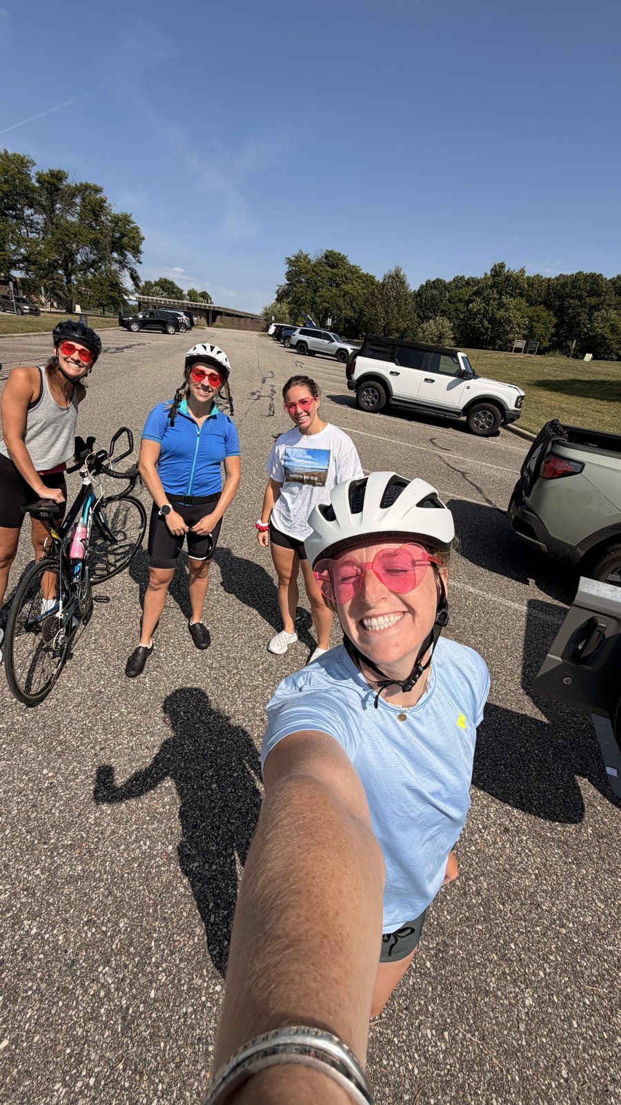 Three girlies in pink sunglasses before a loop at the first ride