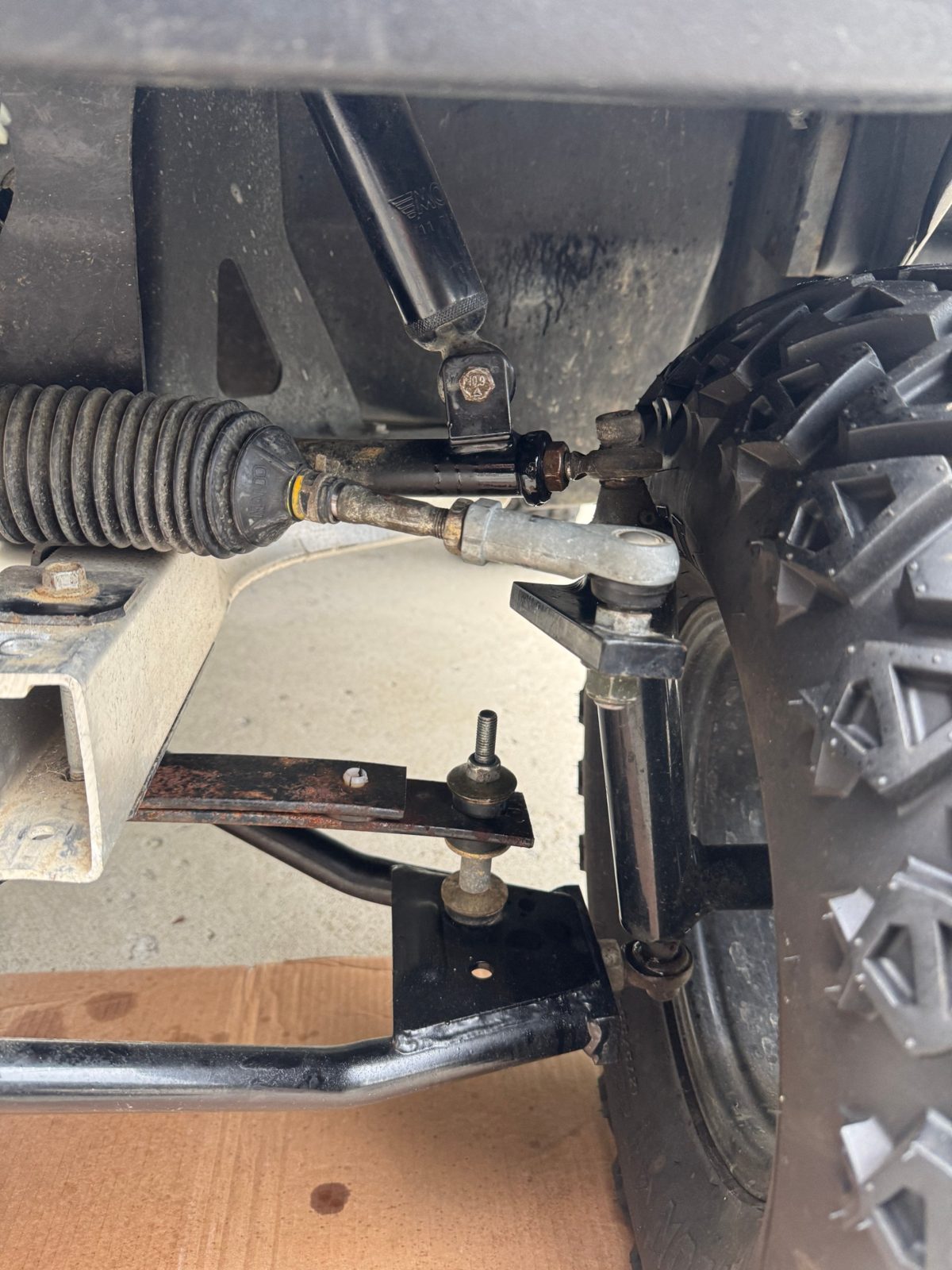 Tie rod end and steering rack on a golf cart during front end alignment