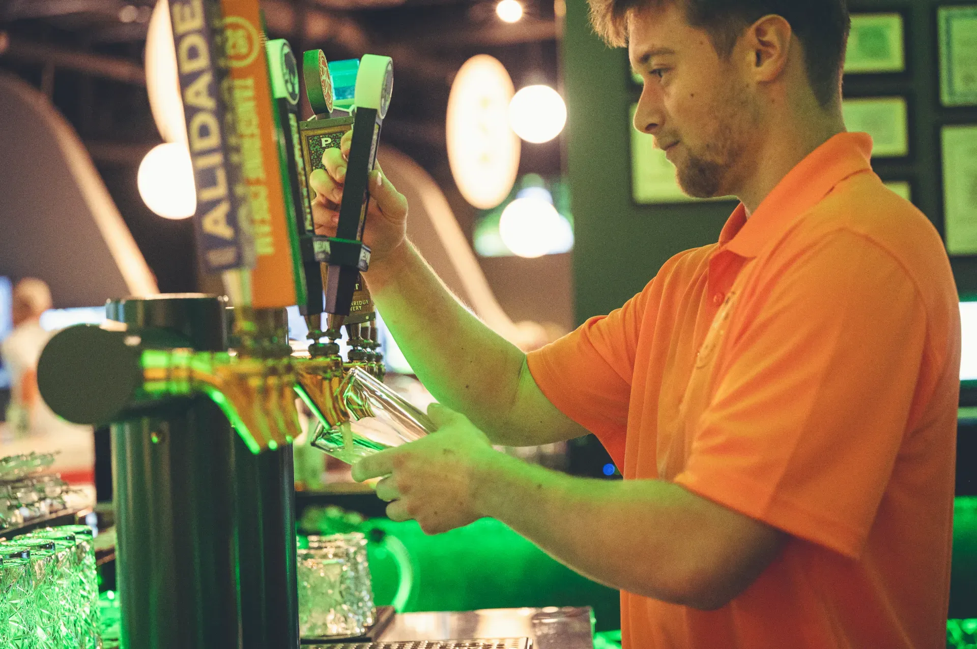Bartender pouring a draft beer at The PAR Club bar in Castle Rock