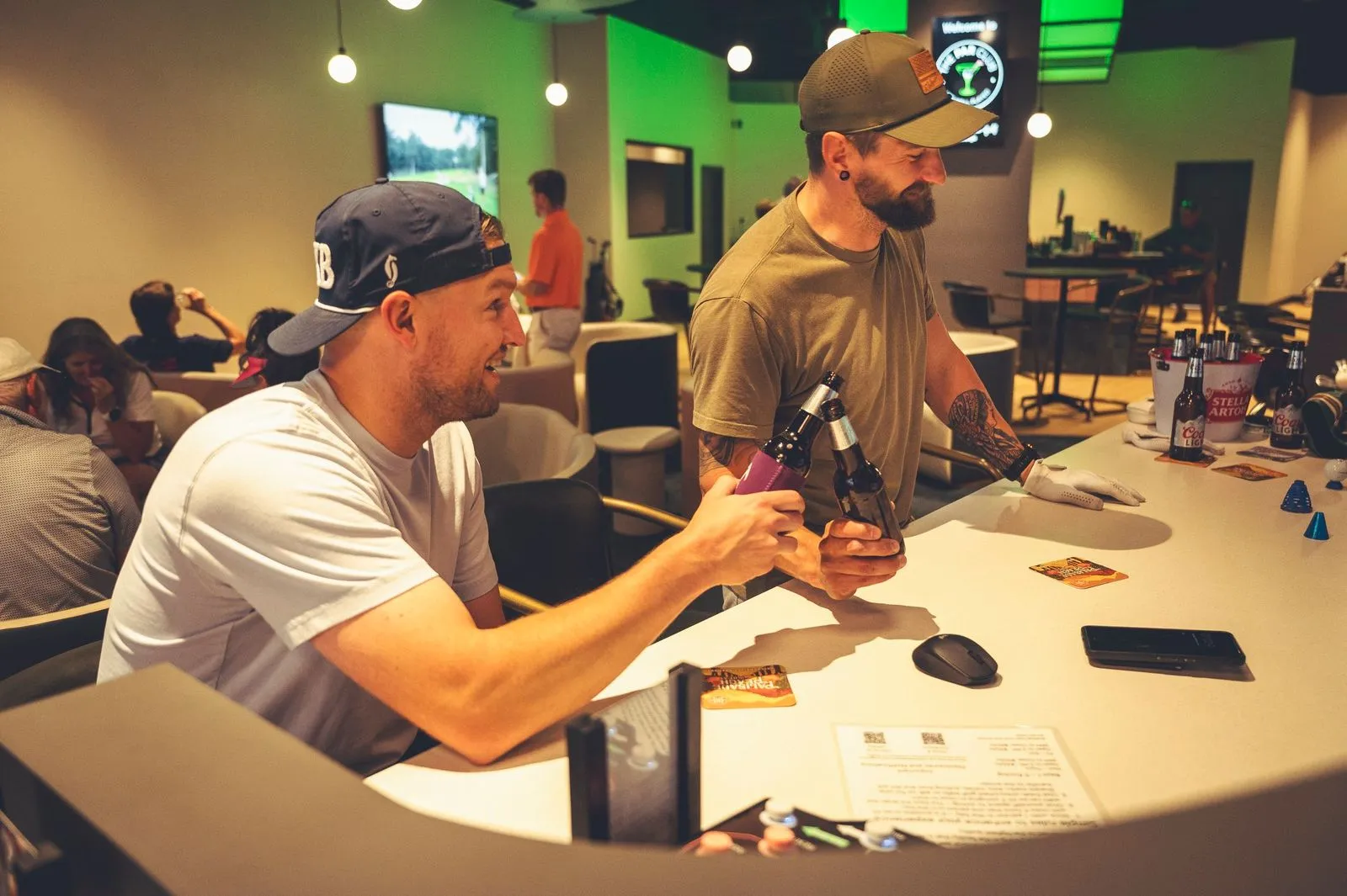 Friends comparing craft beers at the bar at The PAR Club