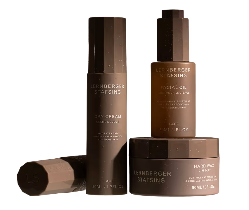 Three brown skincare products from Lernberger Stafsing: day cream, facial oil, and hard wax.