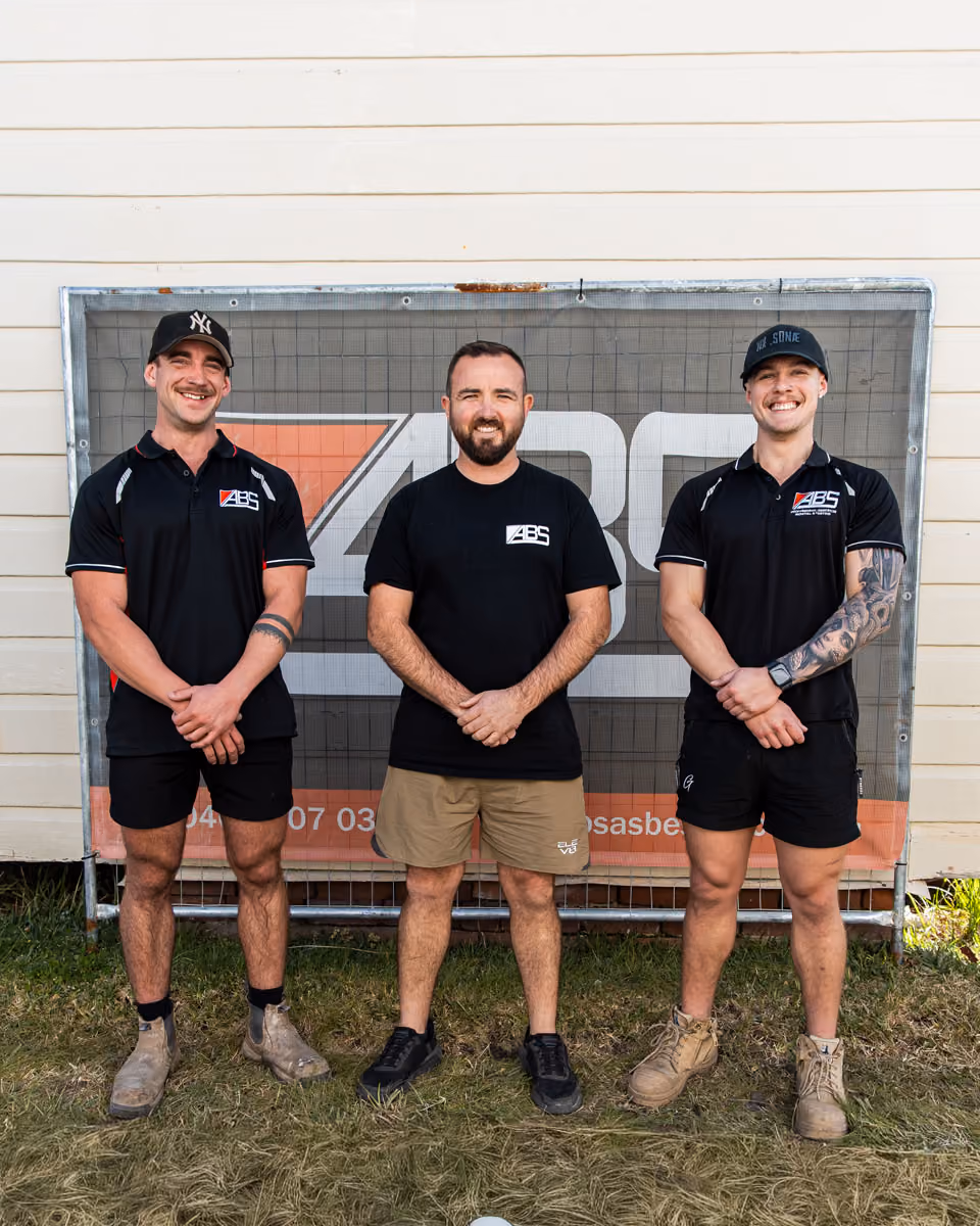 Three man standing and smiling