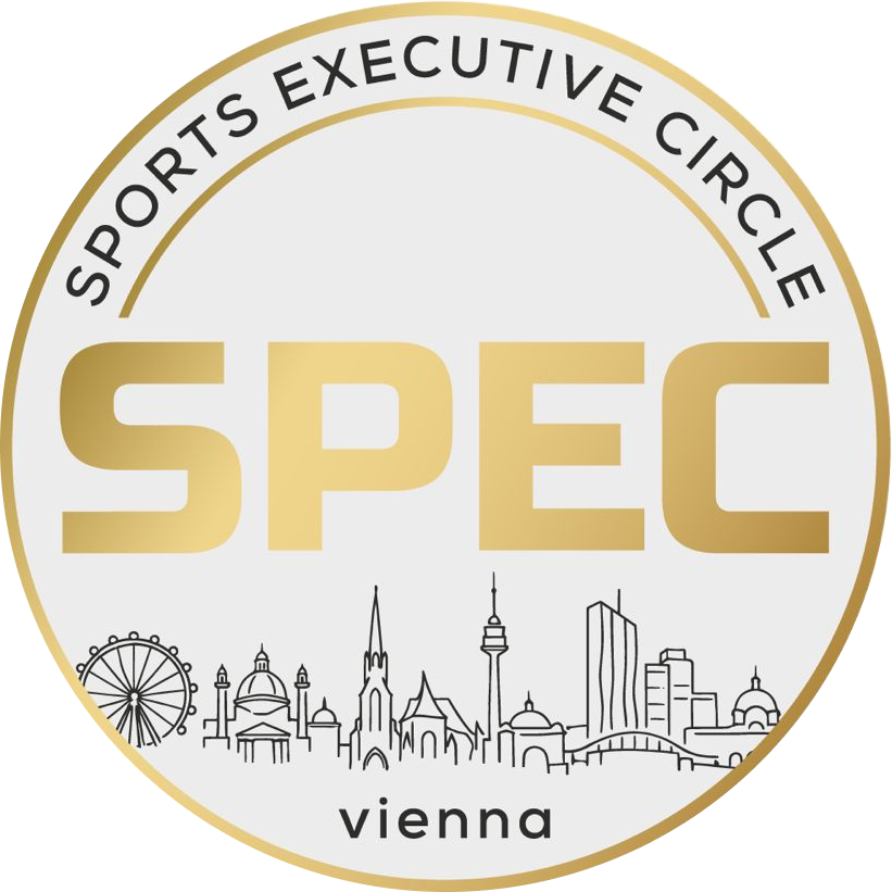 Round logo with a gold border featuring the text 'SPORTS EXECUTIVE CIRCLE' curved along the top, large gold letters 'SPEC' in the center, and a black outline of the Vienna city skyline above the word 'vienna' at the bottom.