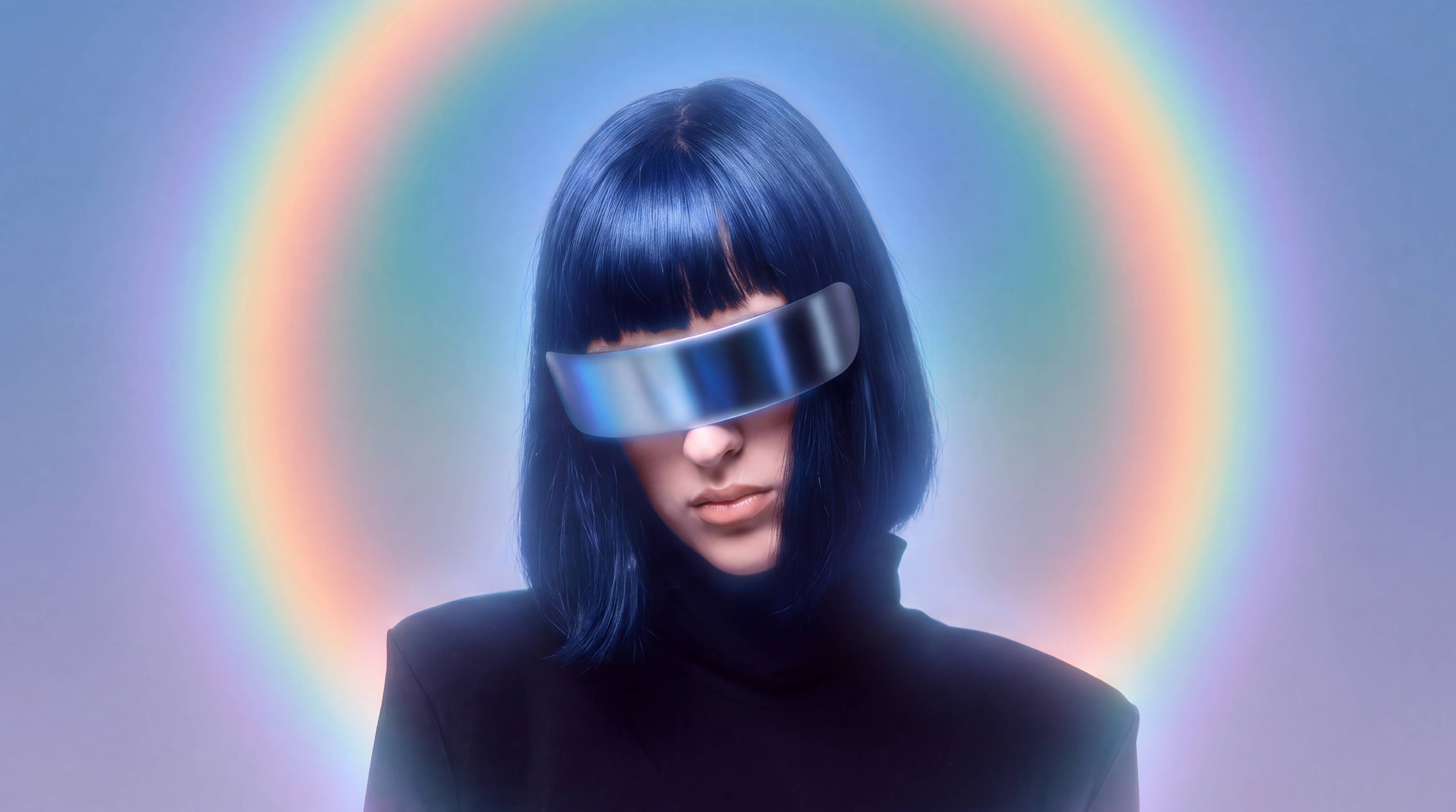 Woman with blue hair and a reflective visor in front of a rainbow halo
