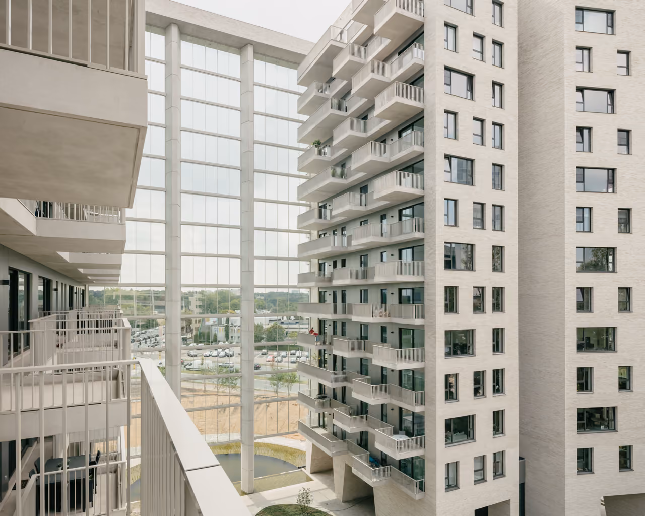 The Louise-Marie towers, residential blocks linked by a full-height glazed atrium.