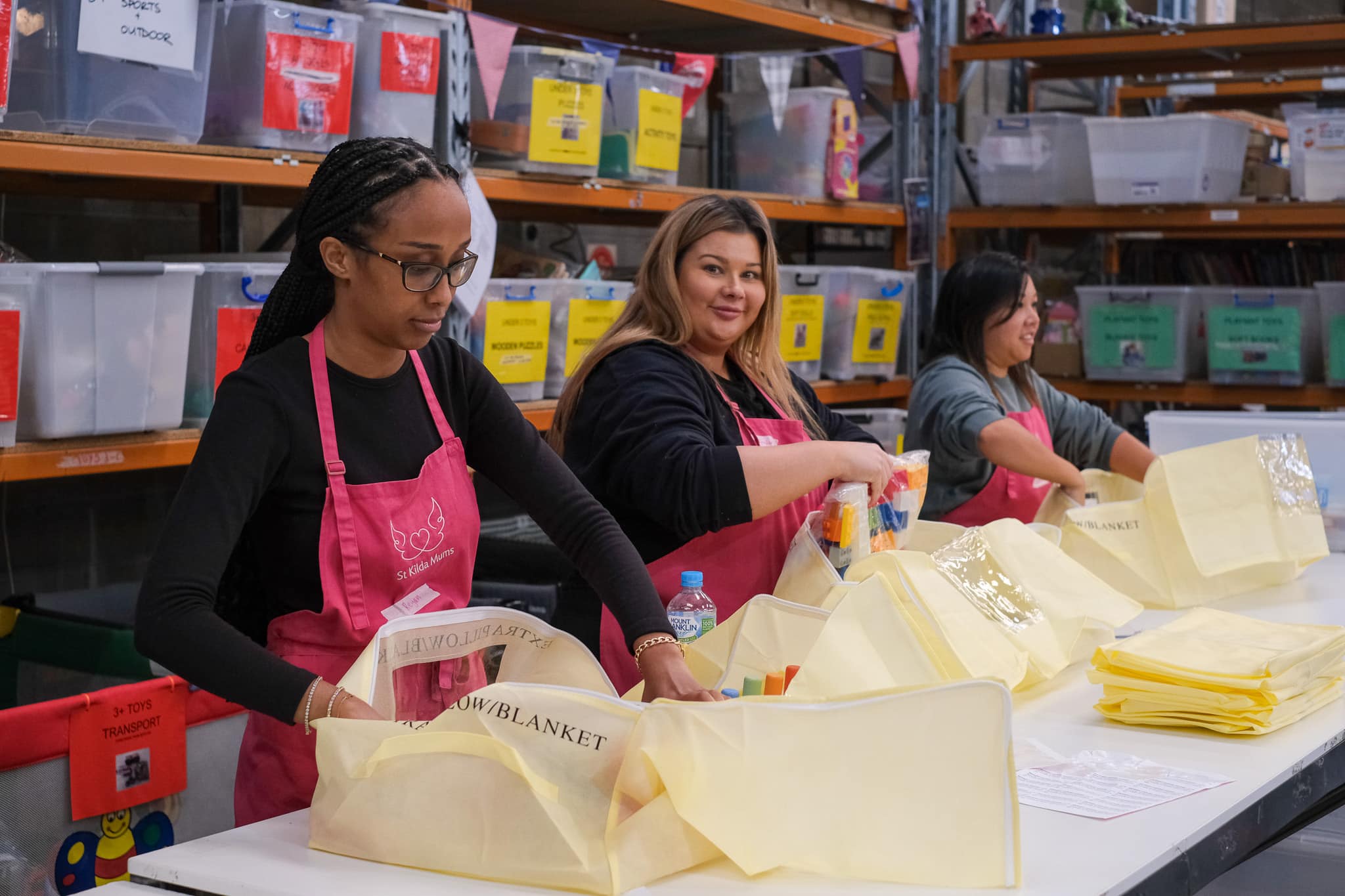 Colleagues volunteer to sort donated goods
