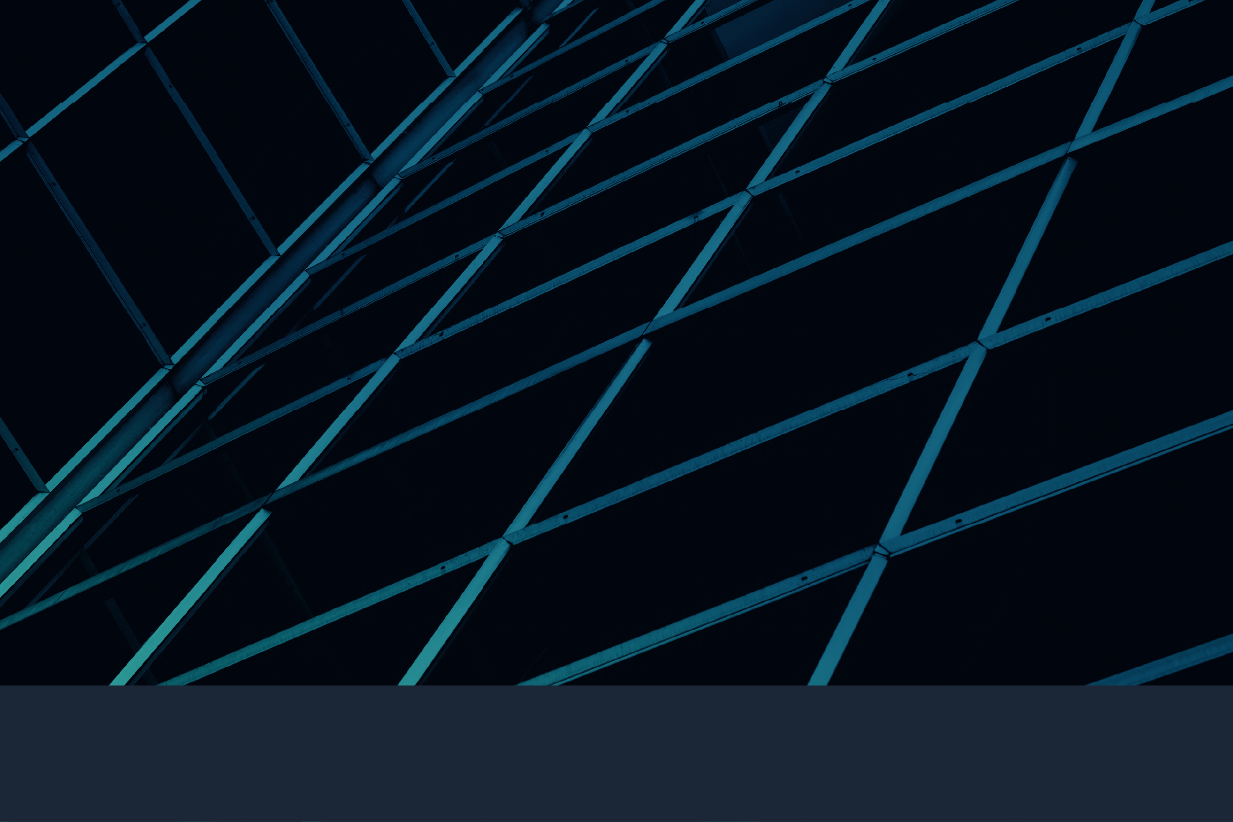 Dark structural lattice inside a secure facility.