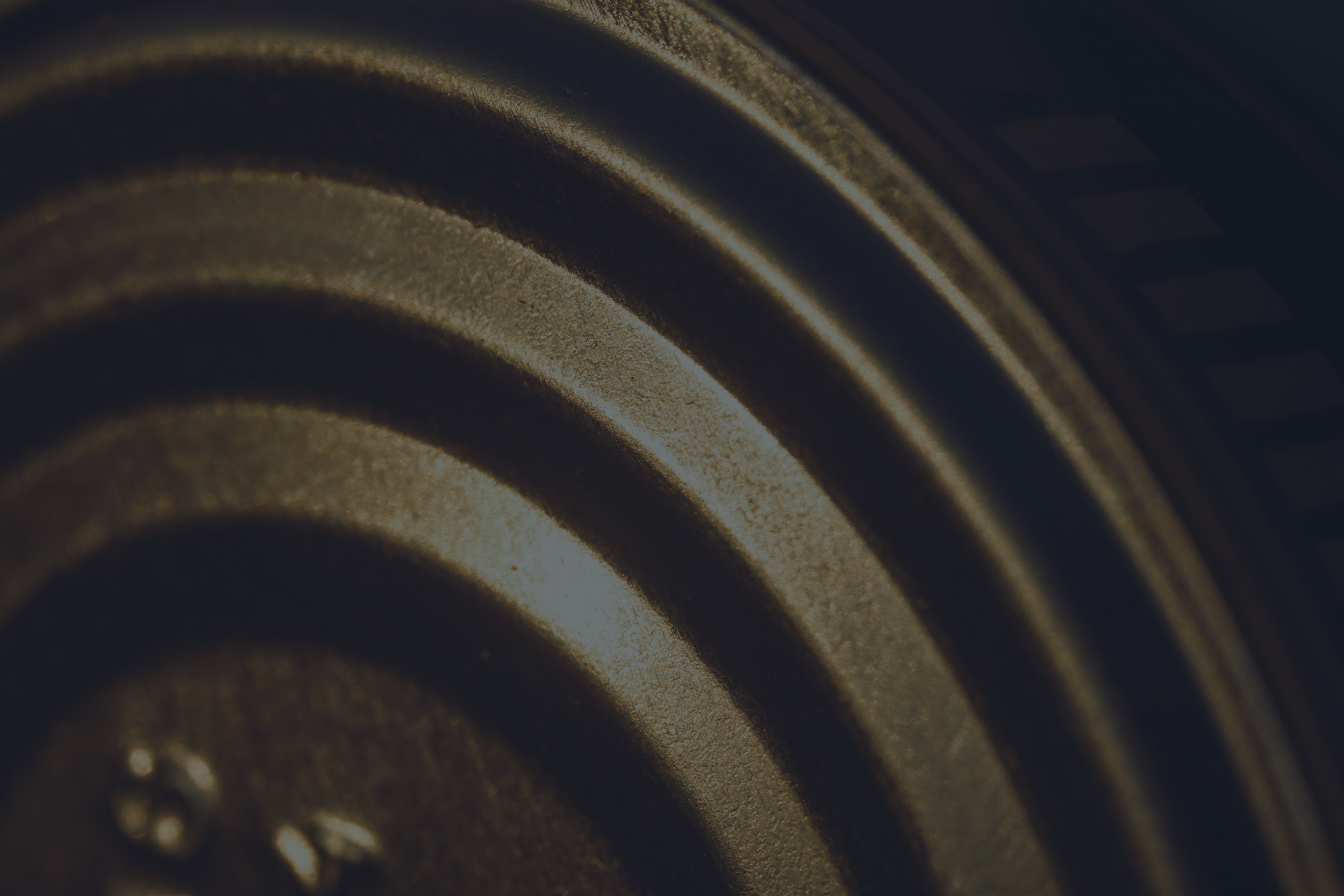 Concentric steel rings of a vault door mechanism.