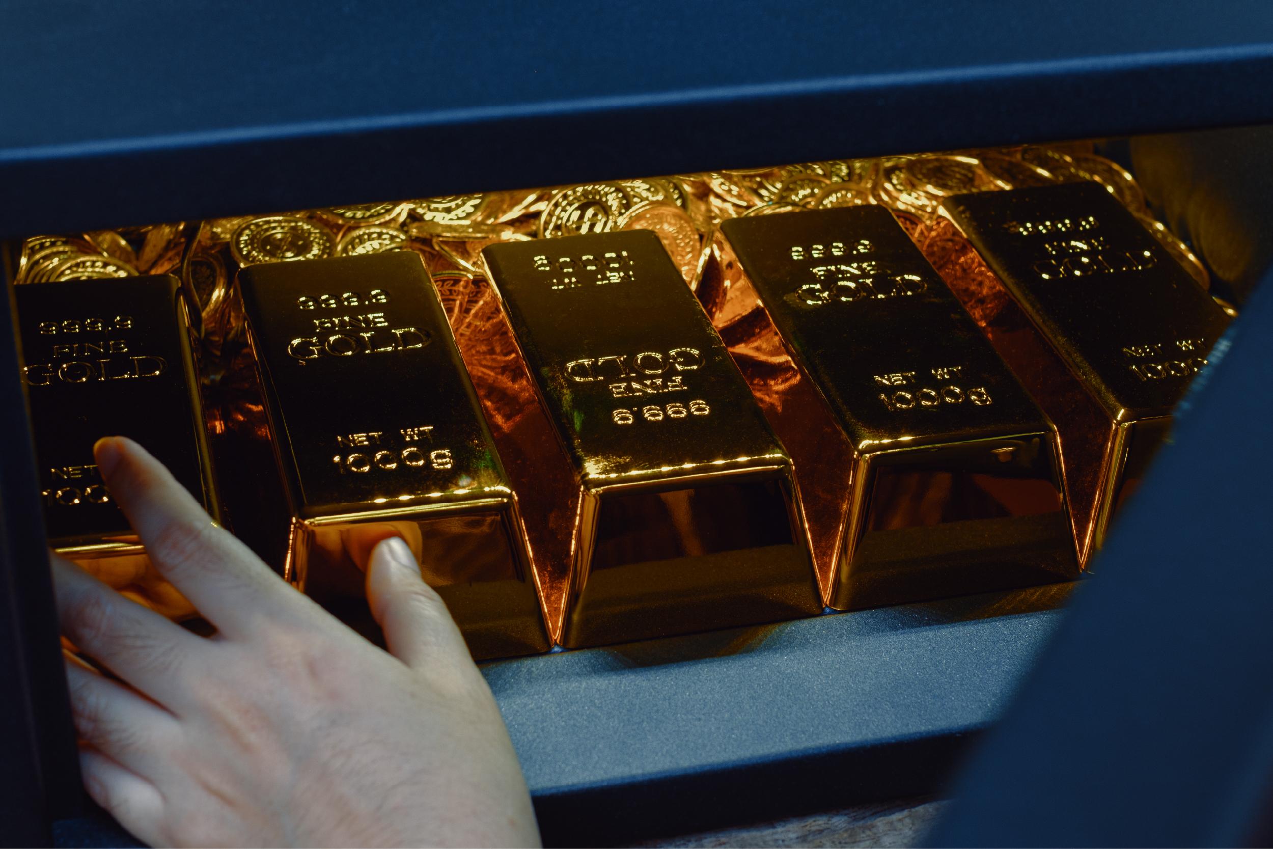 Gold bars being placed into secure storage.