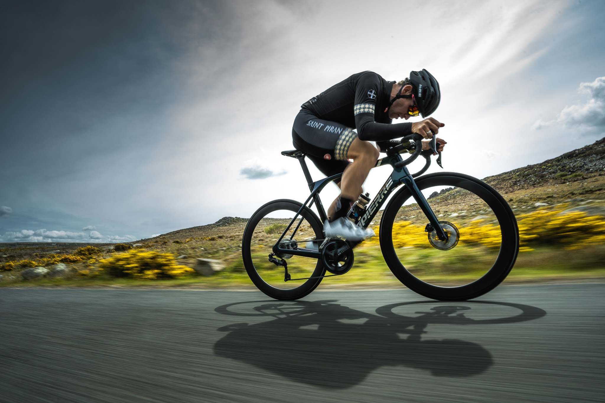 Cyclist riding at speed on an open road