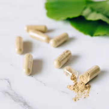 Probiotic capsules on a marble surface