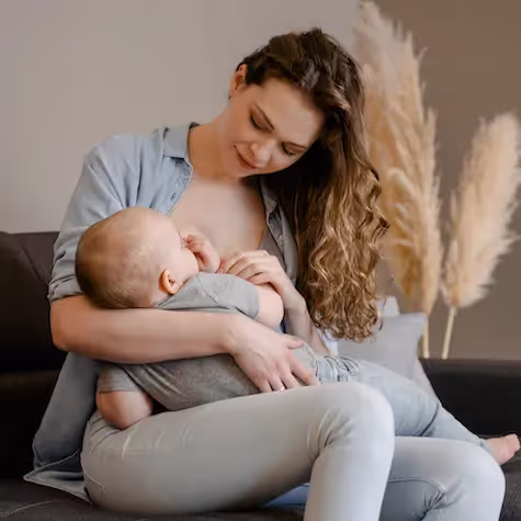 Mother breastfeeding her baby, promoting his immune system