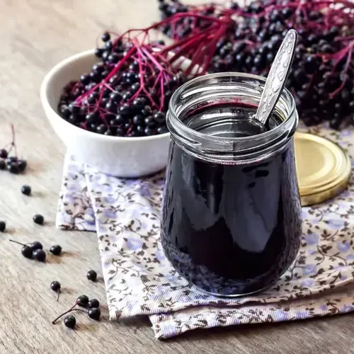 Homemade Elderberry Syrup in a Jar, one of Tiny Health's immune boosting recipes for winter
