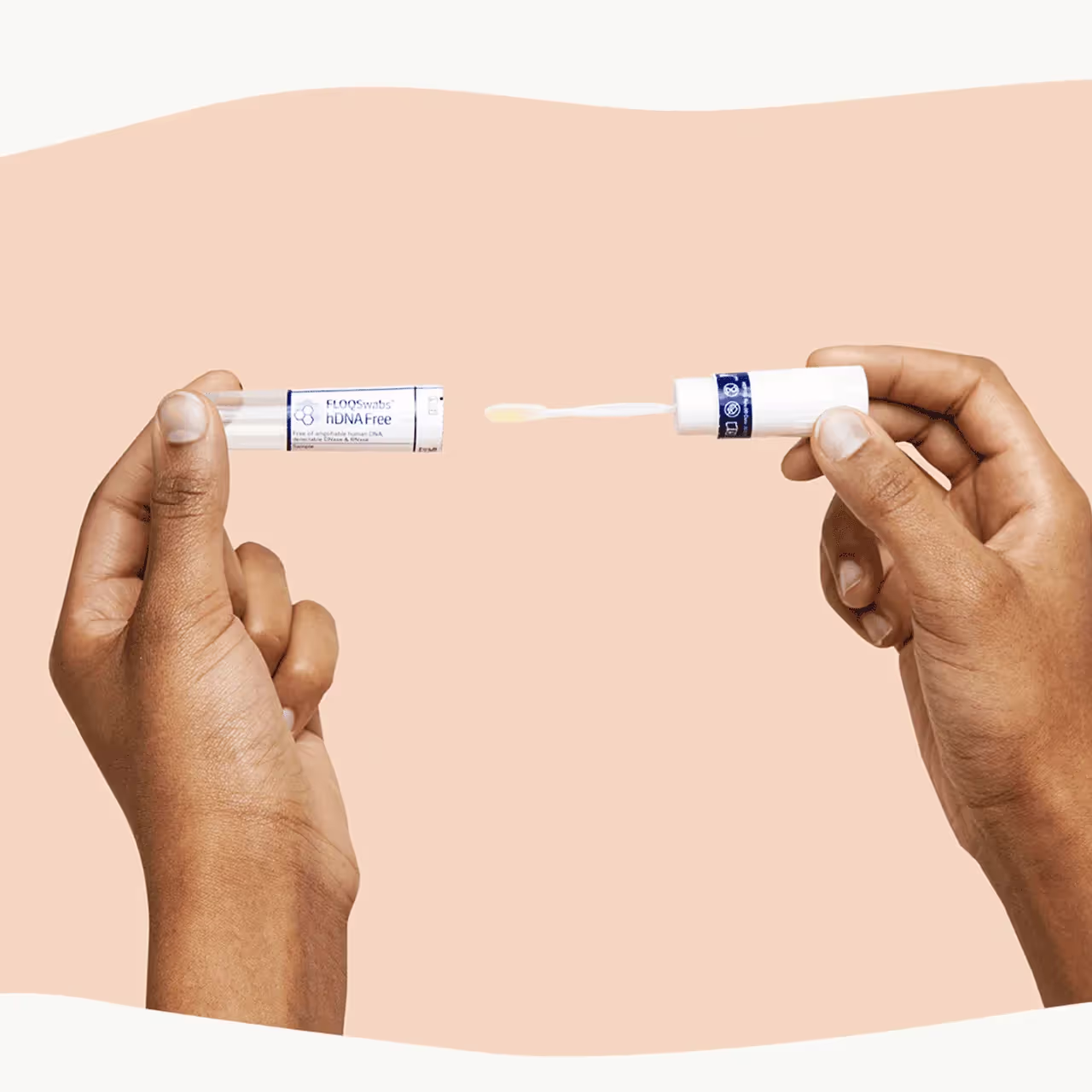 Close-up of a person using a microbiome test, one hand holding a swab tube and the other with a sample applicator