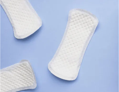 A close-up of 3 menstrual pads 