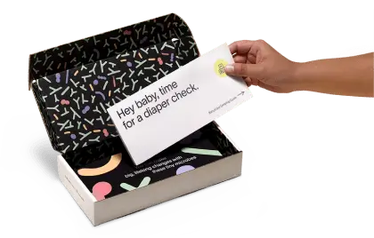 A hand is placing an envelope into an open Tiny Health.