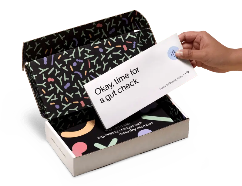 A hand is placing an envelope into an open Tiny Health.