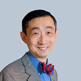A headshot of Dr Yuan, a Tiny Health advisor