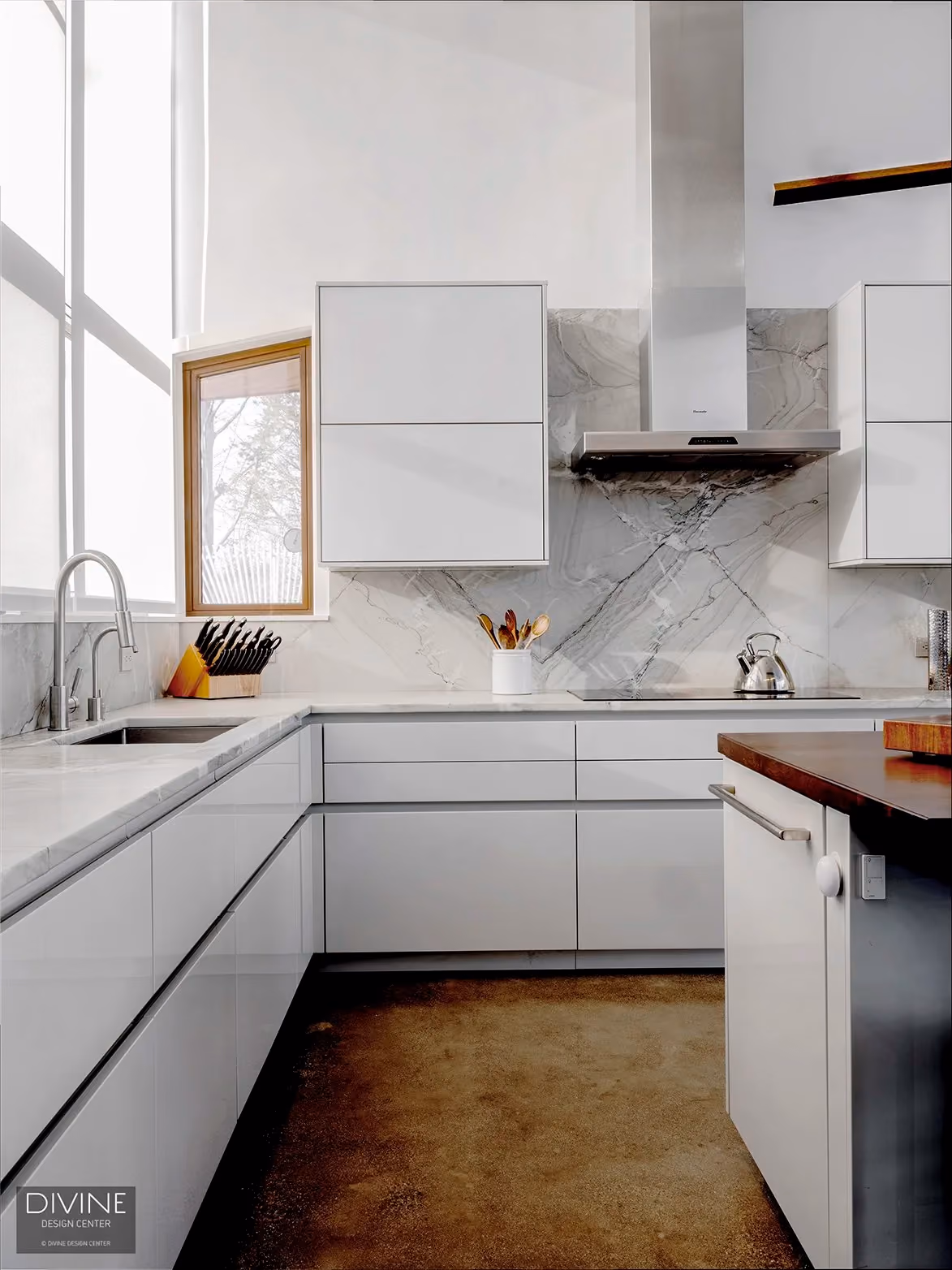 White lacquer kitchen with a stainless steel range hood, marble tile backsplash, a sink, and tall windows