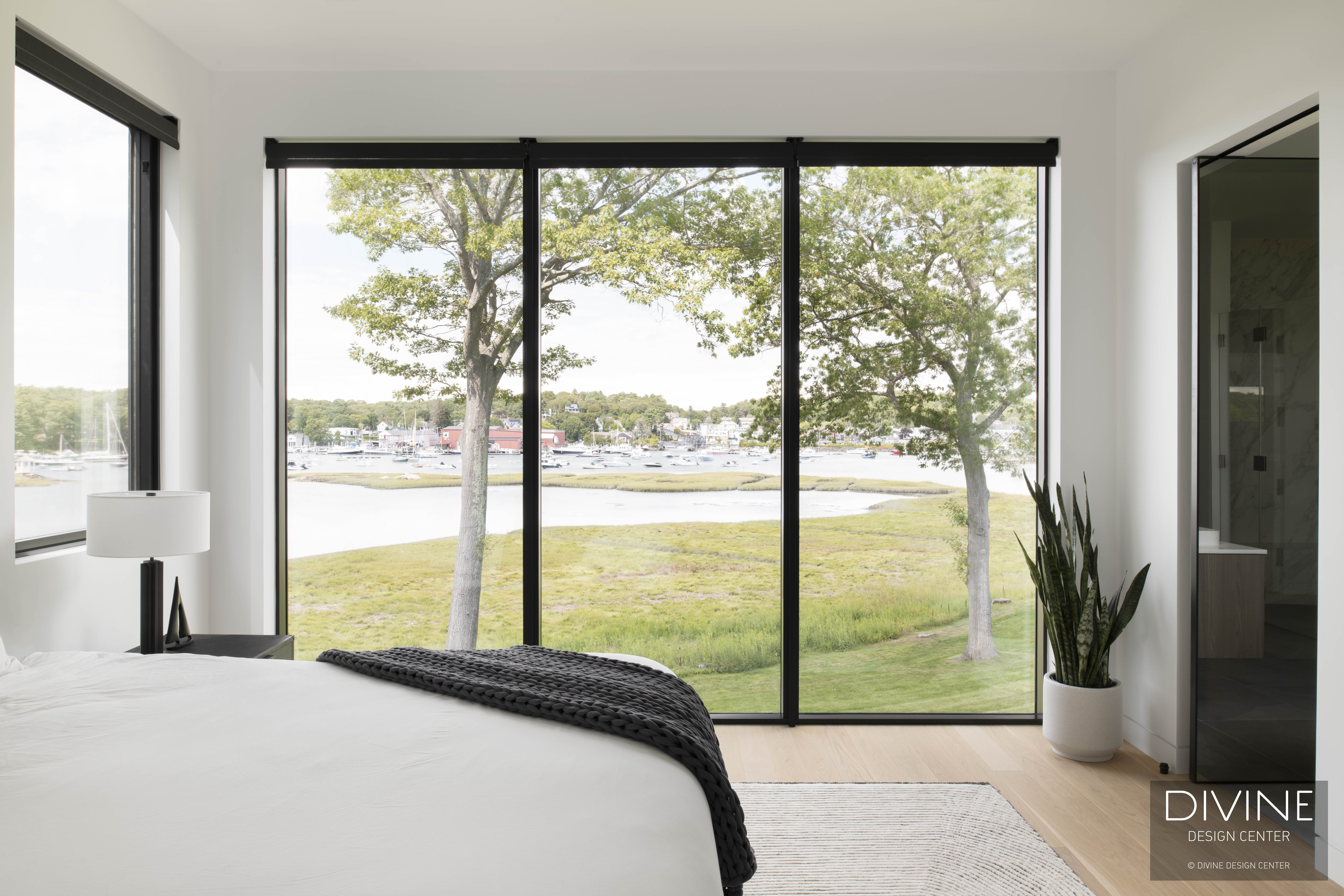 Contemporary bedroom with neutral palette, modern Italian leather accents