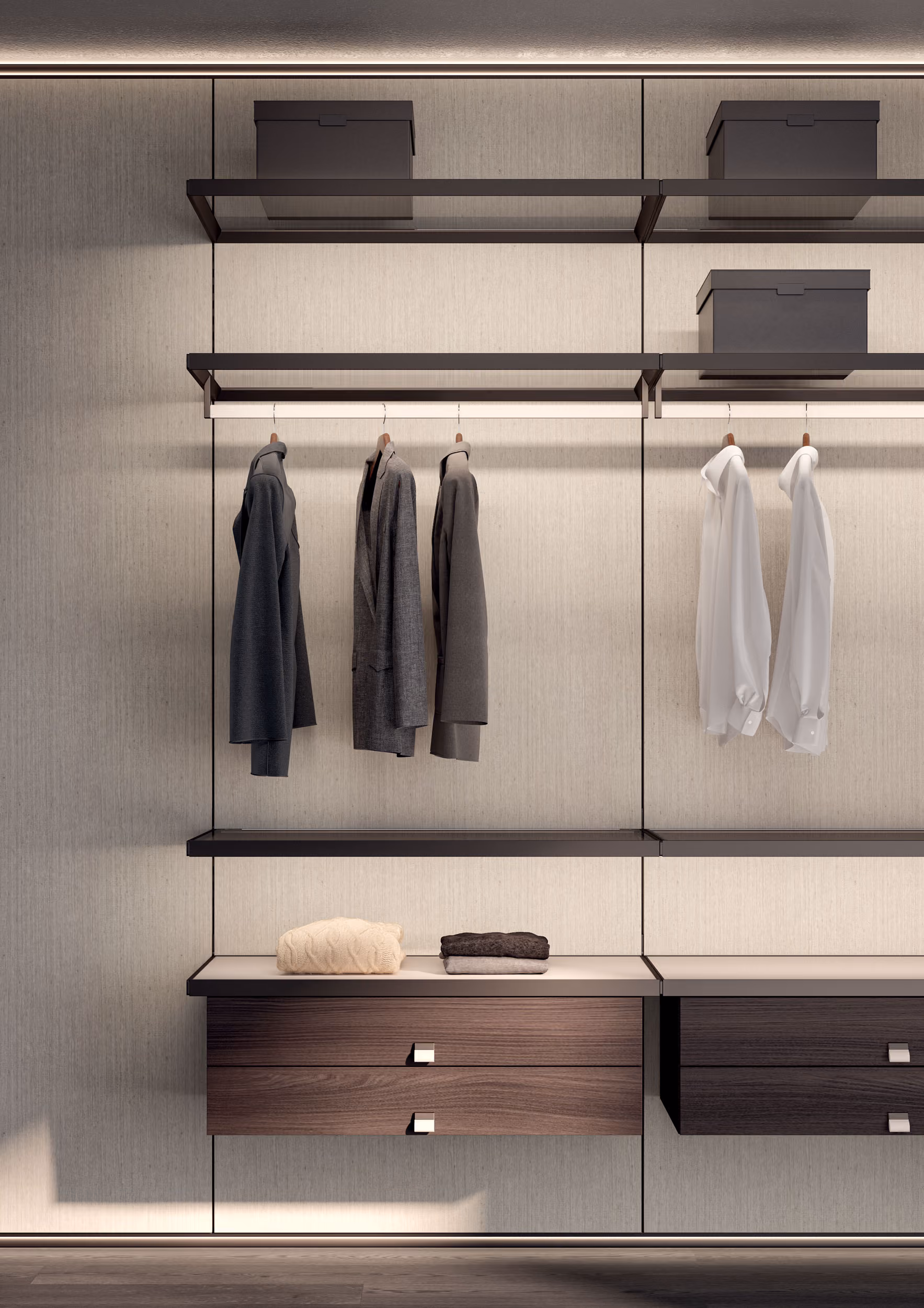 Modern wardrobe with hanging jackets and shirts, shelves with boxes, and folded sweaters on counter.
