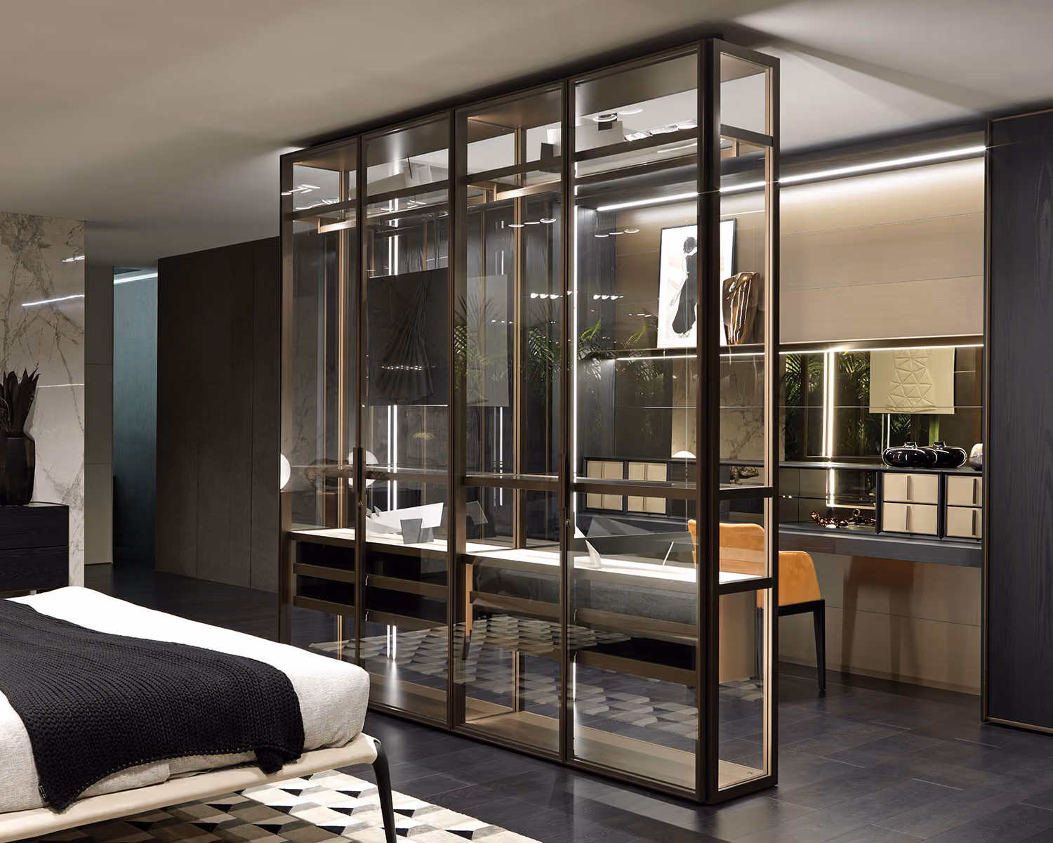 Modern bedroom with glass-enclosed workspace, black knitted blanket, and geometric rug on dark floor.