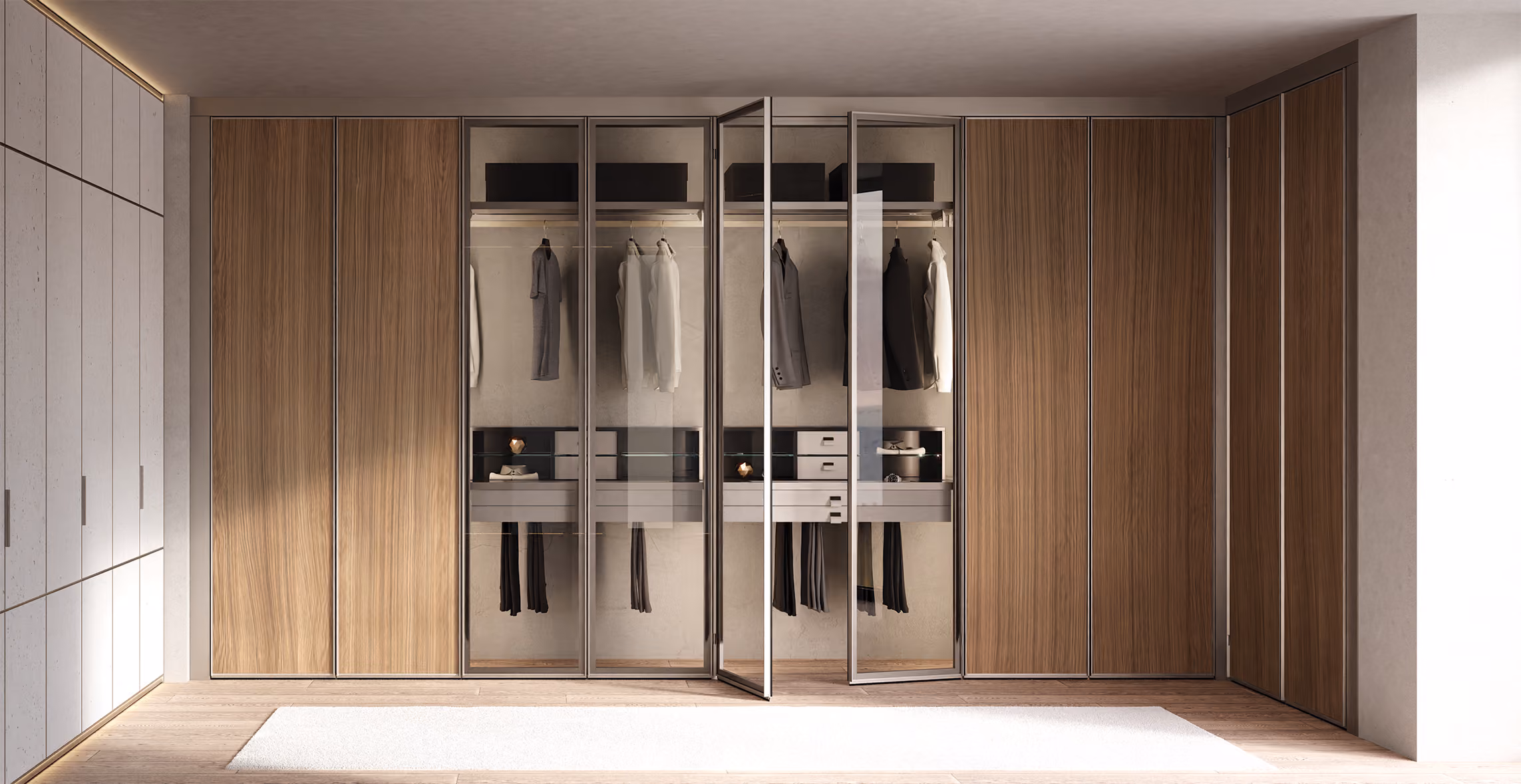 Modern walk-in closet with glass doors, wood panels, hanging clothes, and drawers inside.