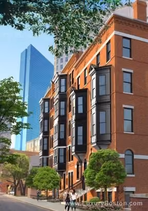 Red brick multi-story residential building with black bay windows and small trees in front, with modern glass skyscraper and blue sky in the background.