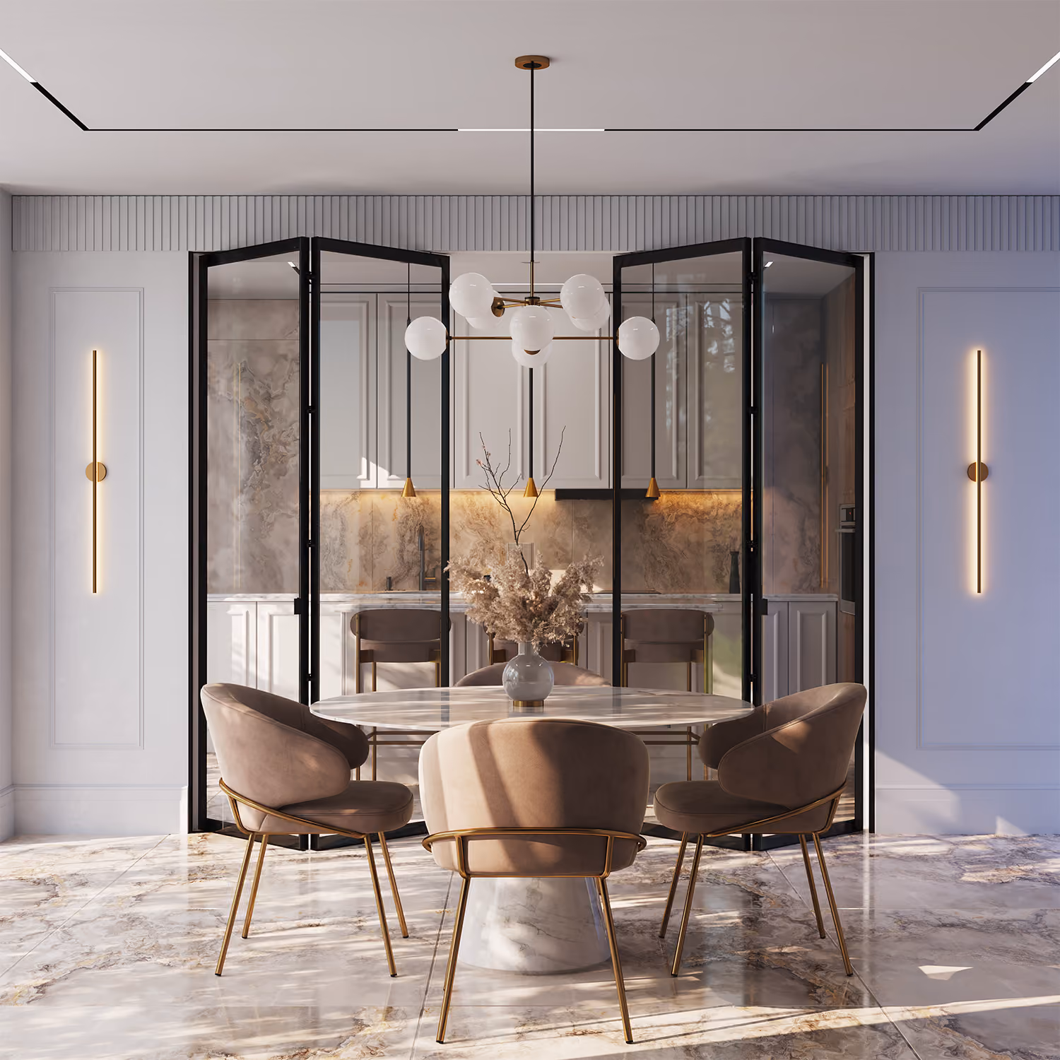 Modern dining area with a round marble table and four beige velvet chairs with gold legs, situated in front of a glass folding partition that opens to a kitchen with marble backsplash and under-cabinet lighting, illuminated by a contemporary chandelier with spherical white glass shades and two vertical wall sconces on either side.