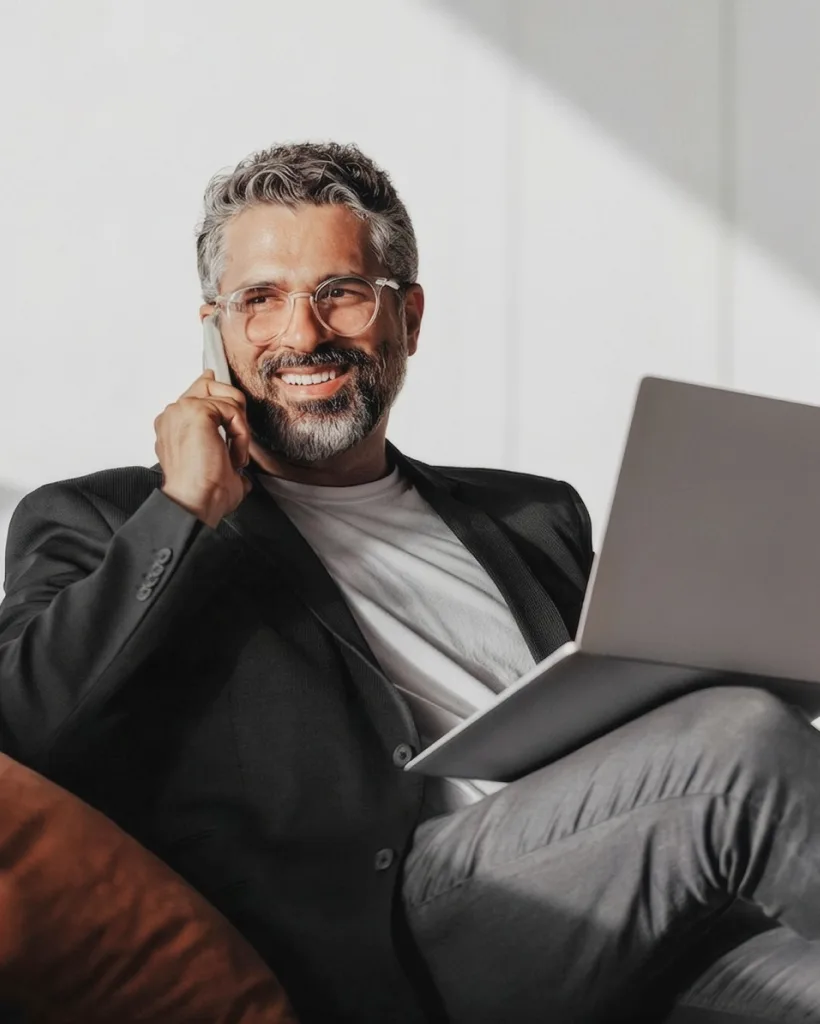 Accountant on a call reviewing client work on a laptop
