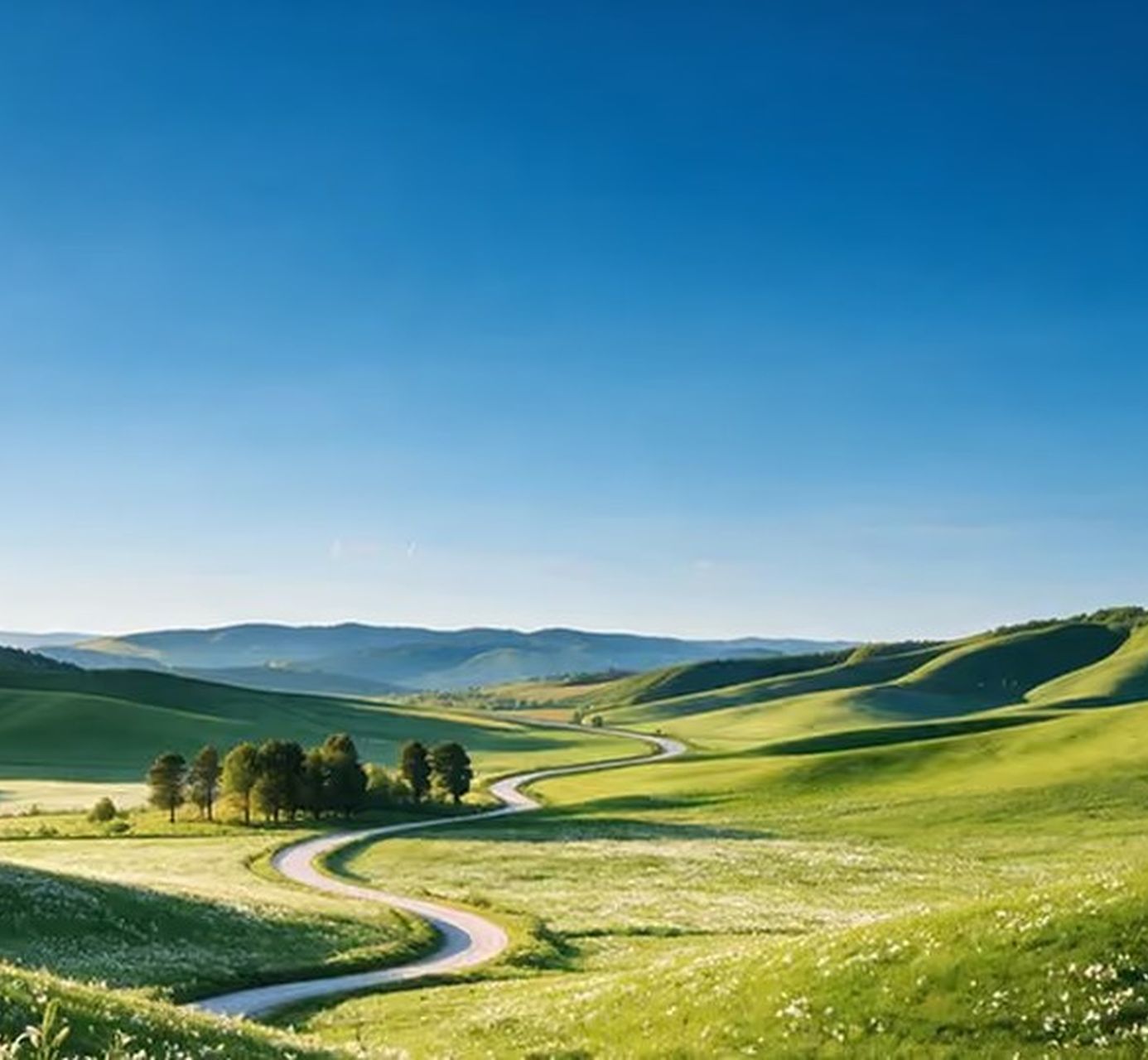 Rolling green hills under a clear blue sky