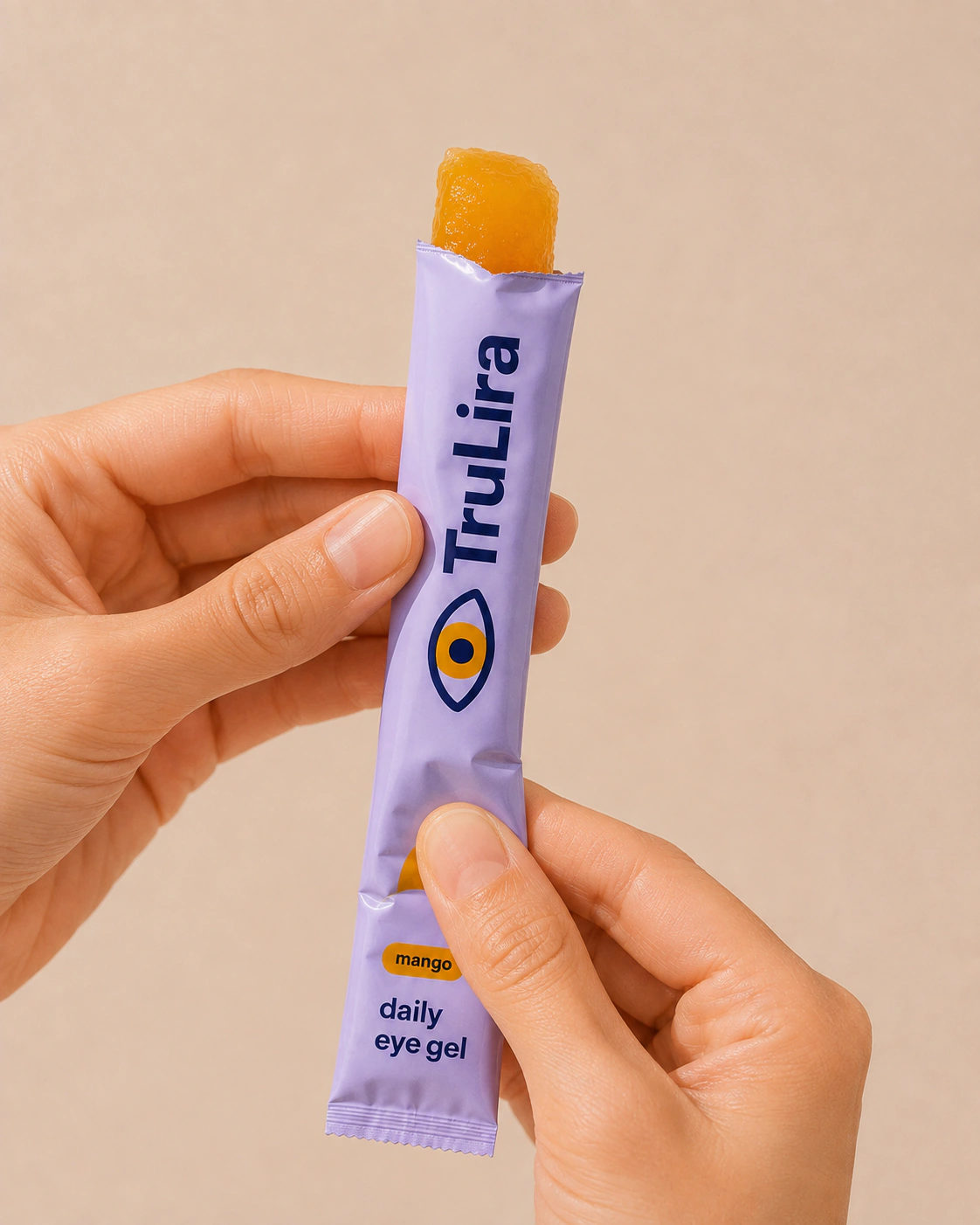 Soft mango gel squeezed upward from the open sachet.