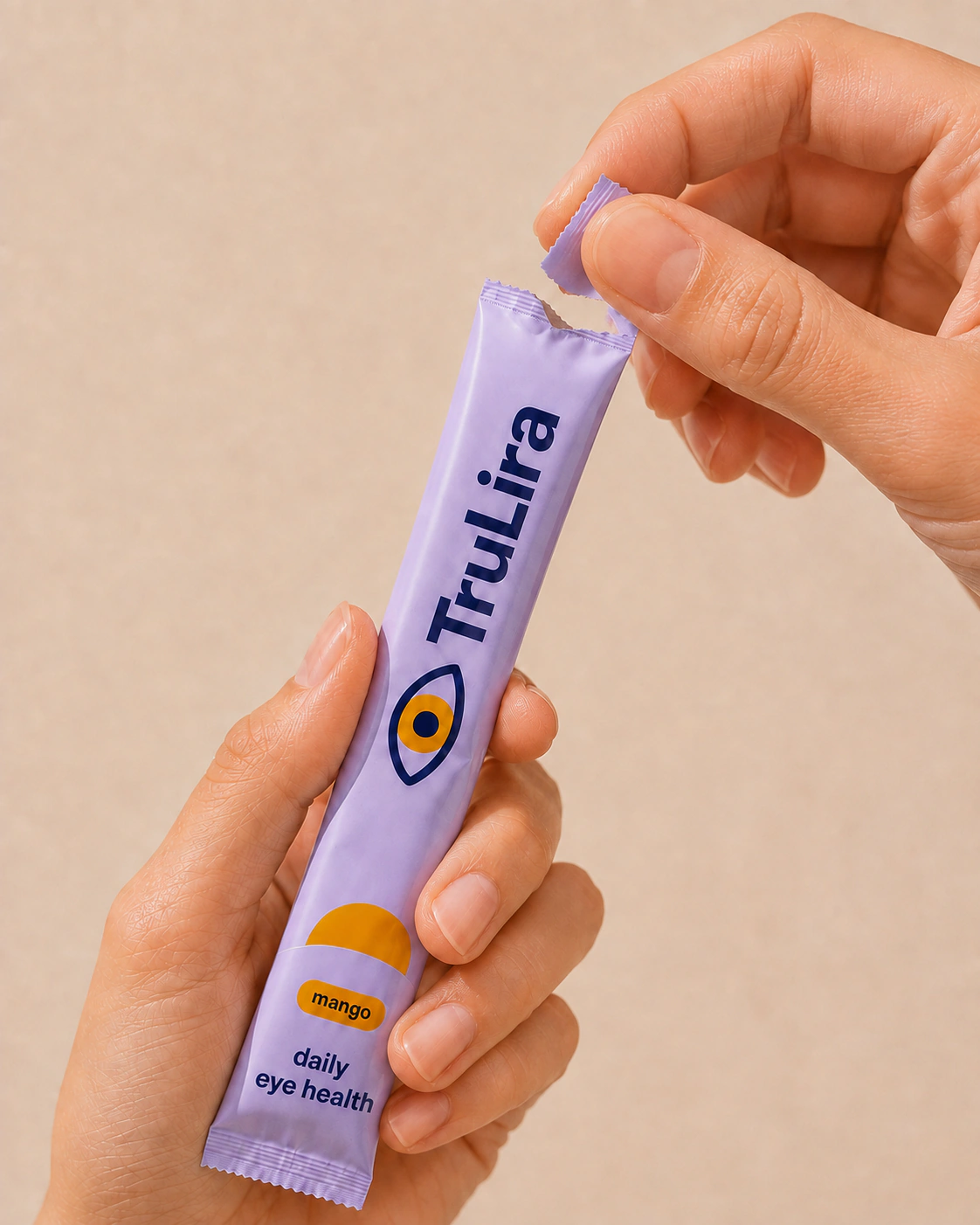 Hands tearing open a TruLira sachet.