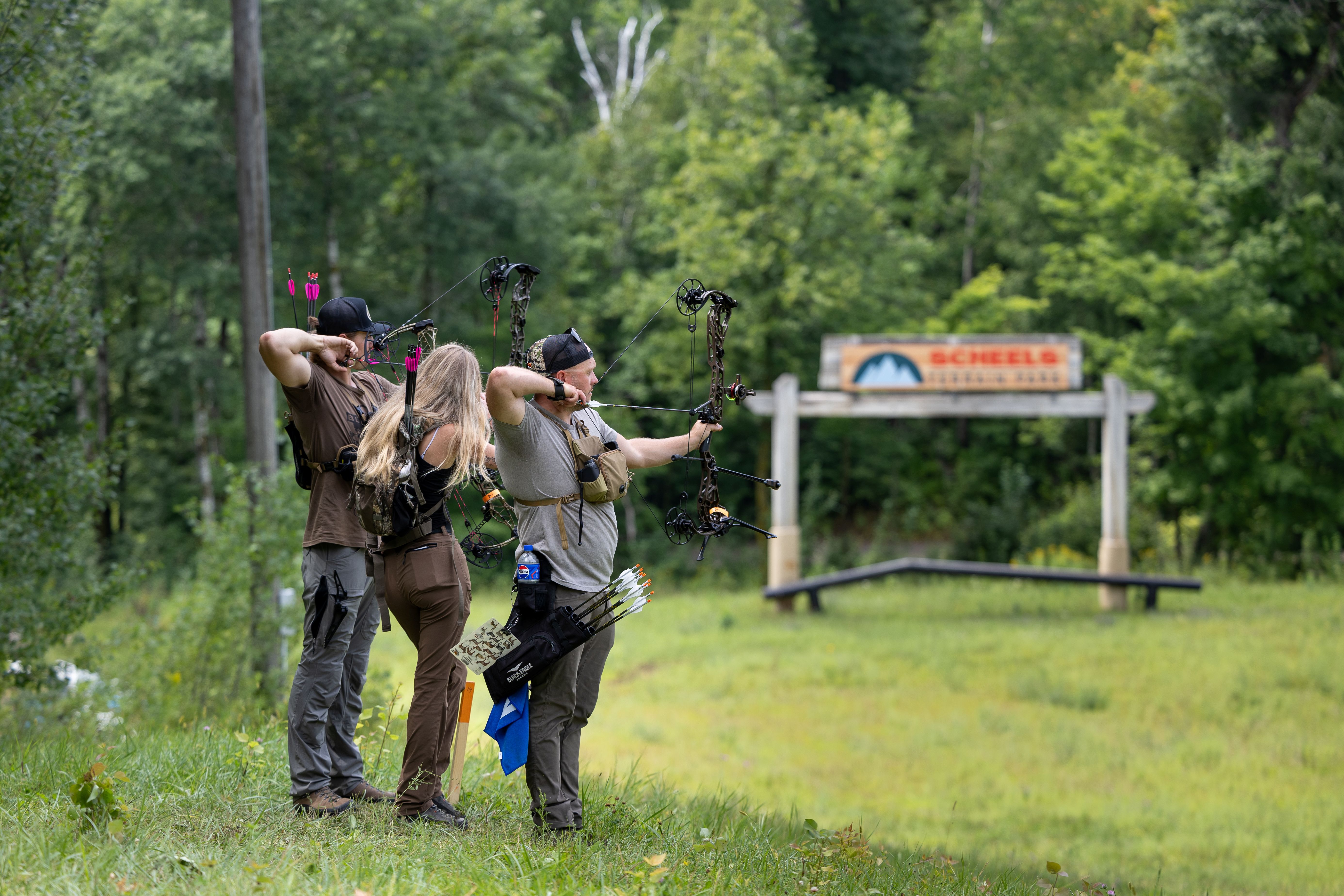 Archers shooting outdoors at ArrowFest at Detroit Mountain