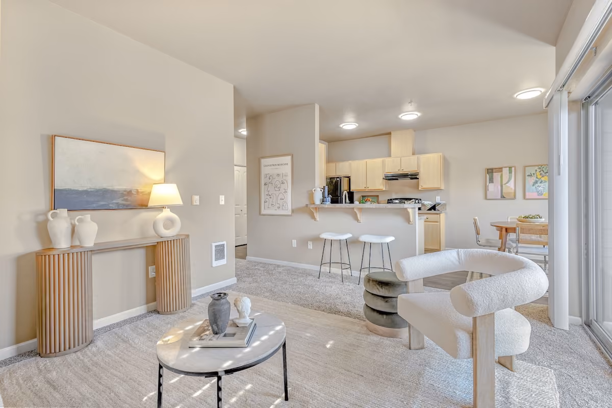 Living room with open layout kitchen at Orchard Ridge in Salem, Oregon