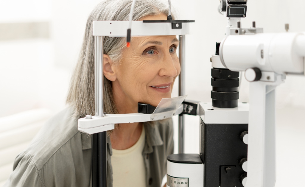 Female patient receiving a retina exam