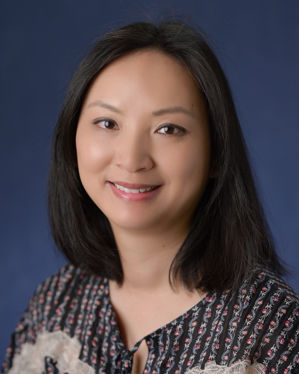 Headshot of Claire Zheng-Kinoshita