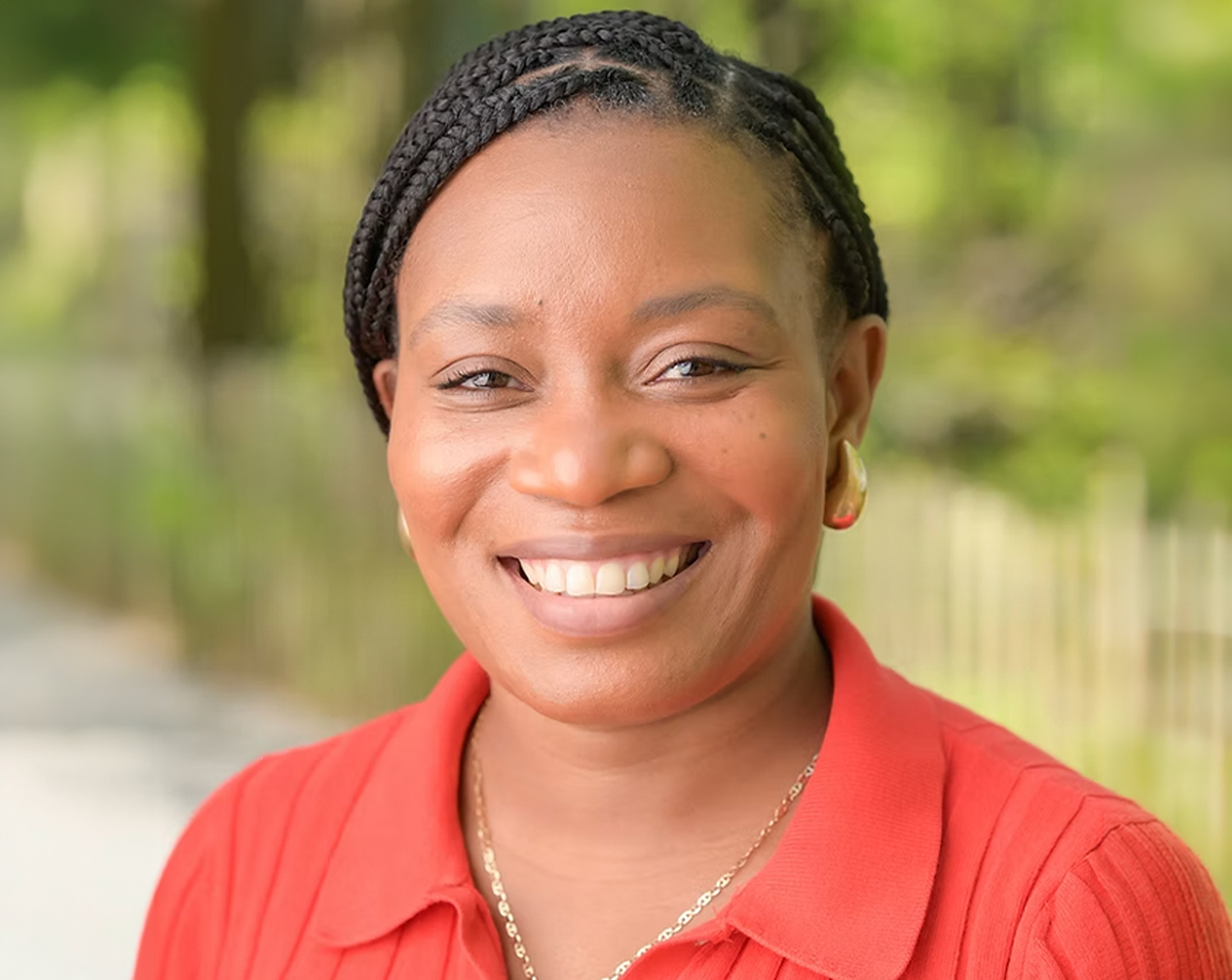 Head of School Maria Horsford headshot in front of Battery Park grassy field