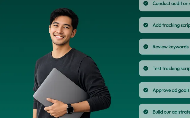 Smiling young man wearing a black long-sleeve shirt and smartwatch, holding a closed silver laptop against a dark green background with partial checklist visible on the right.