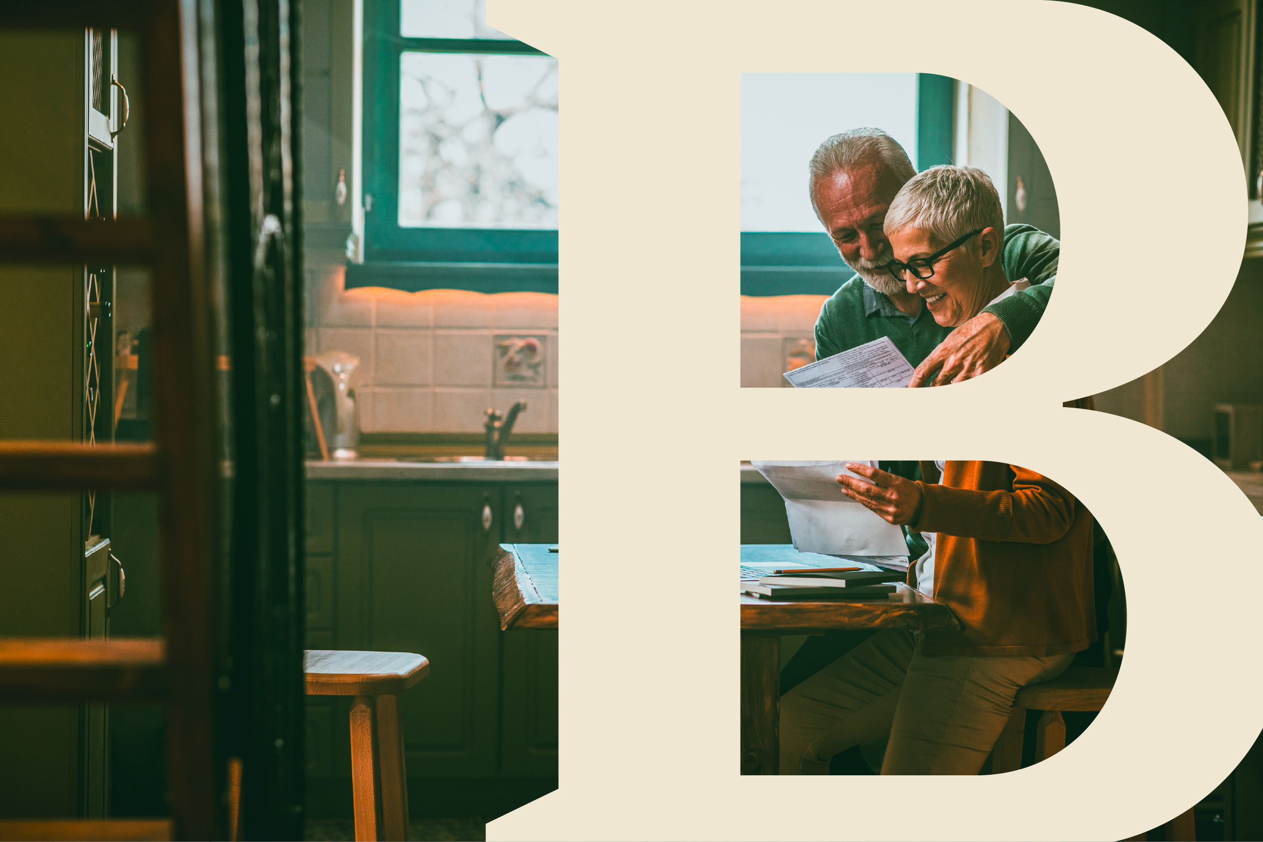 An older couple read a document at a kitchen table seen through a doorway.