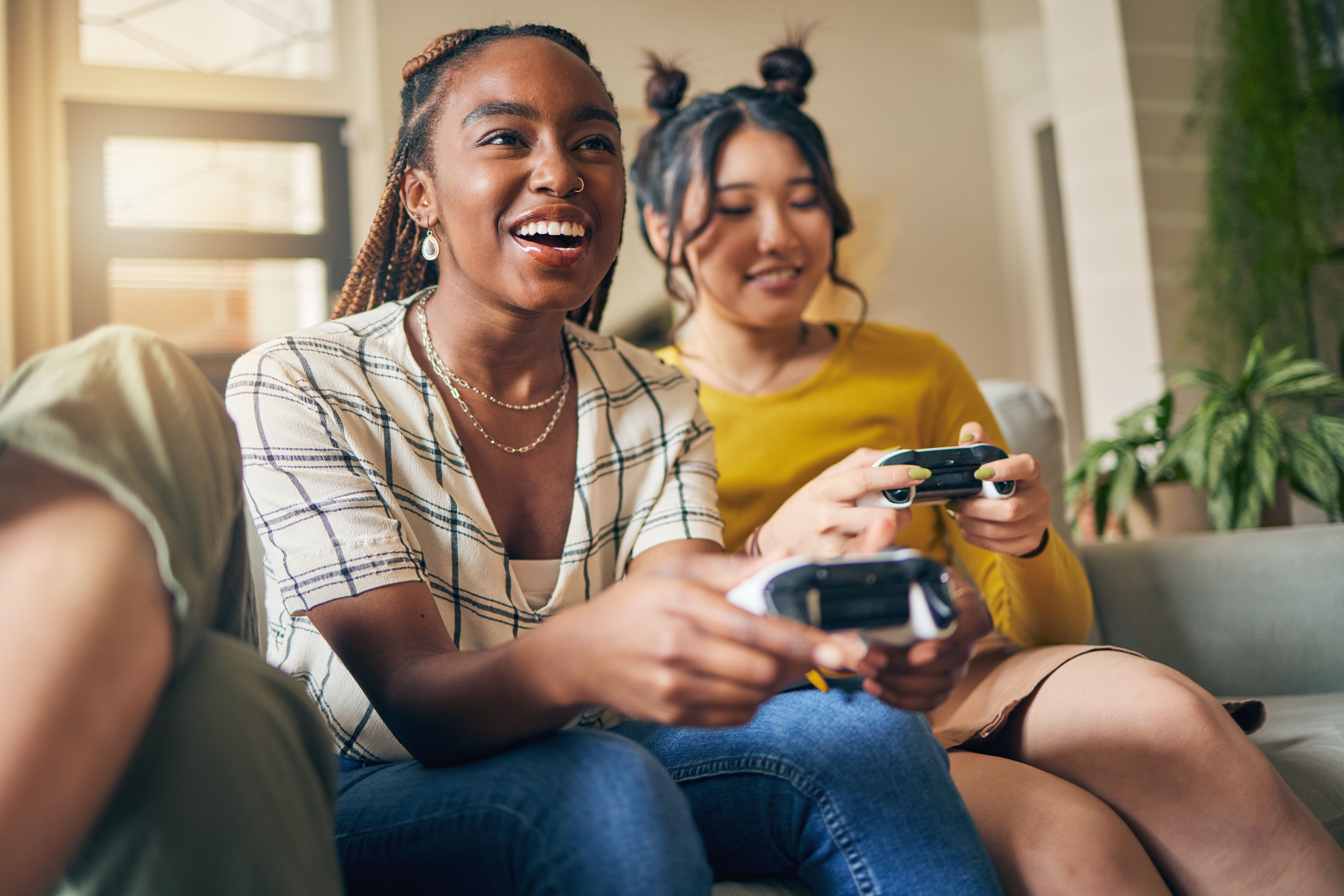 Girls playing video game stock image