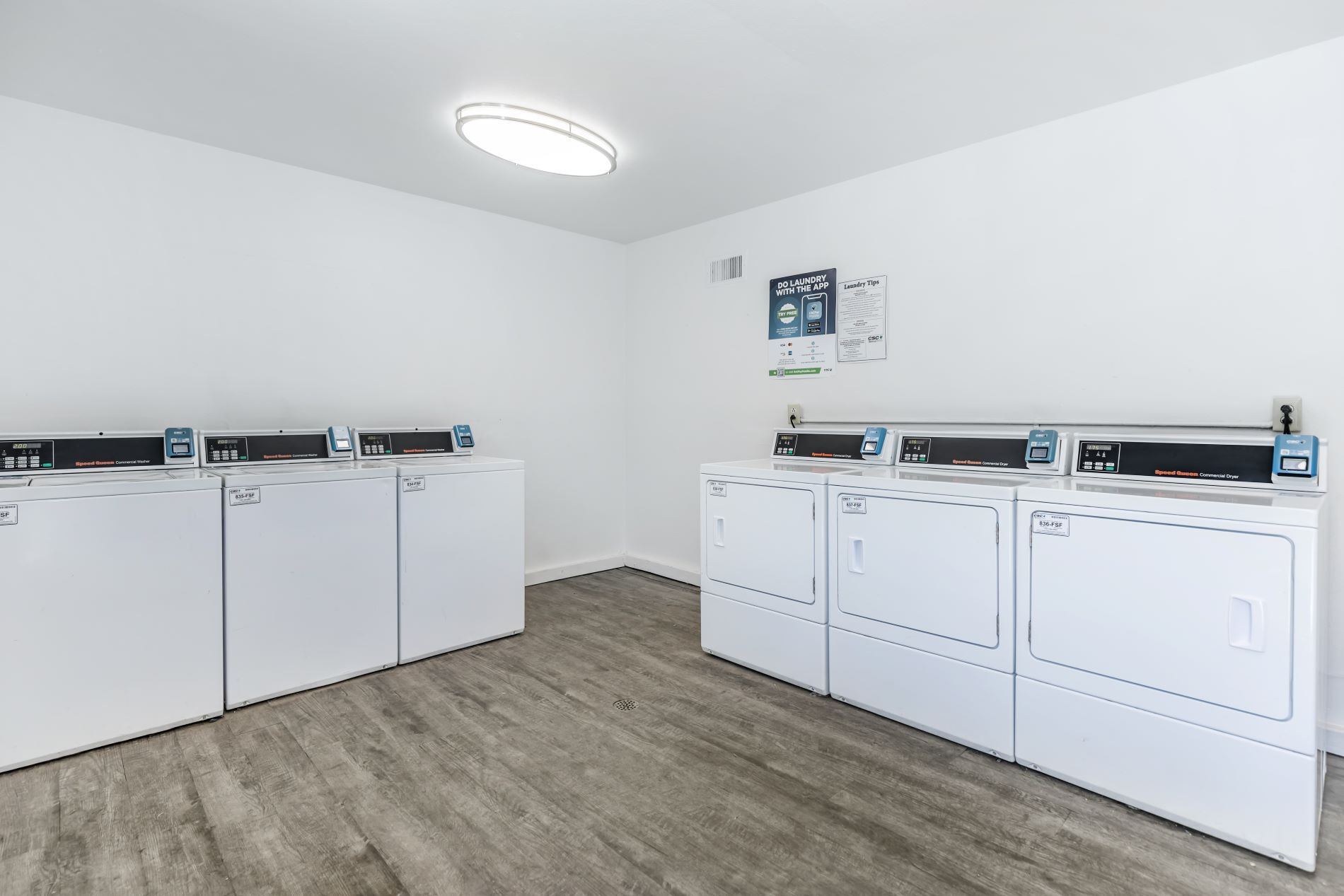 Laundry facilities with white appliances